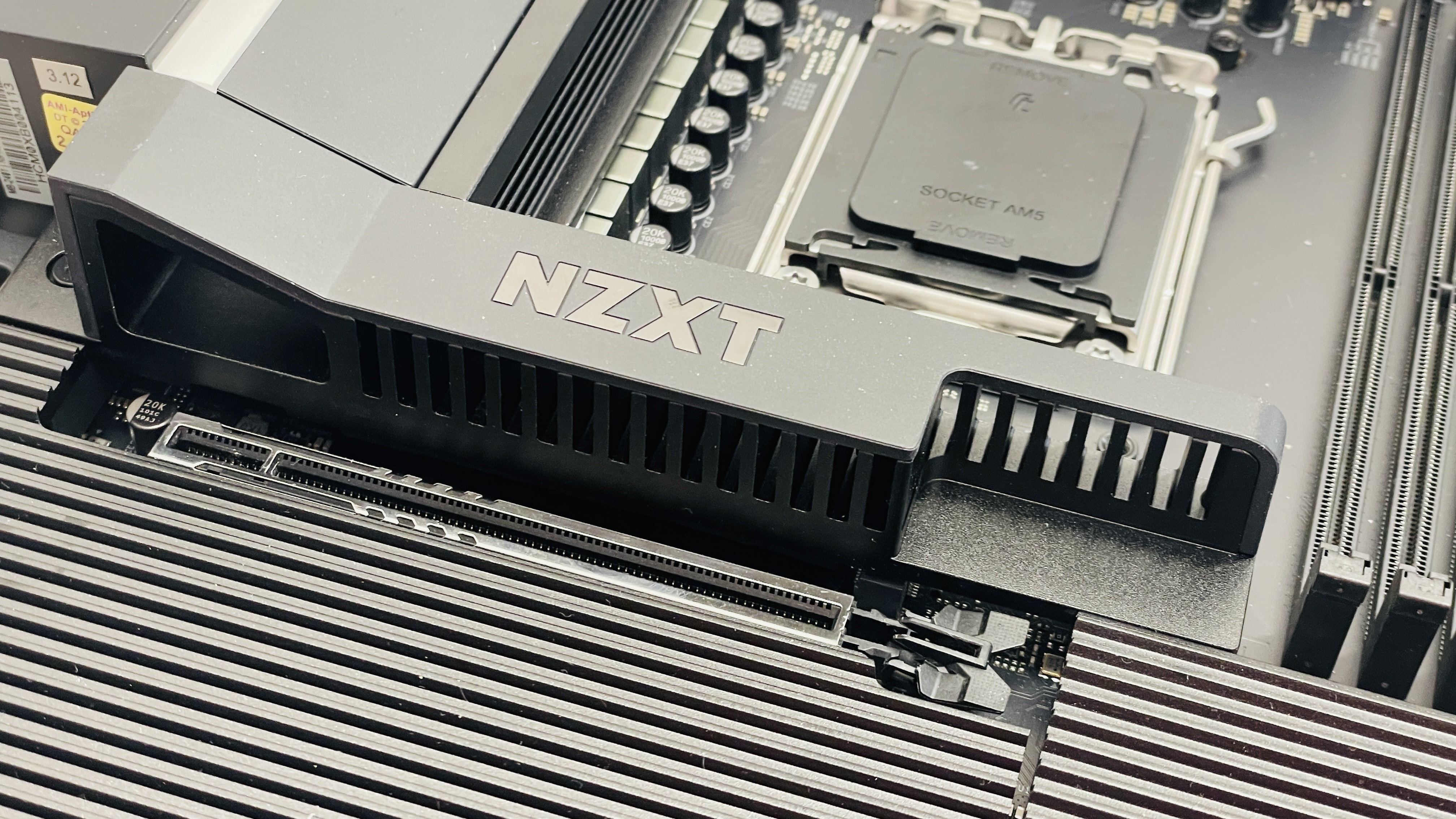 An NZXT N9 X870E motherboard in black with the port covers removed.