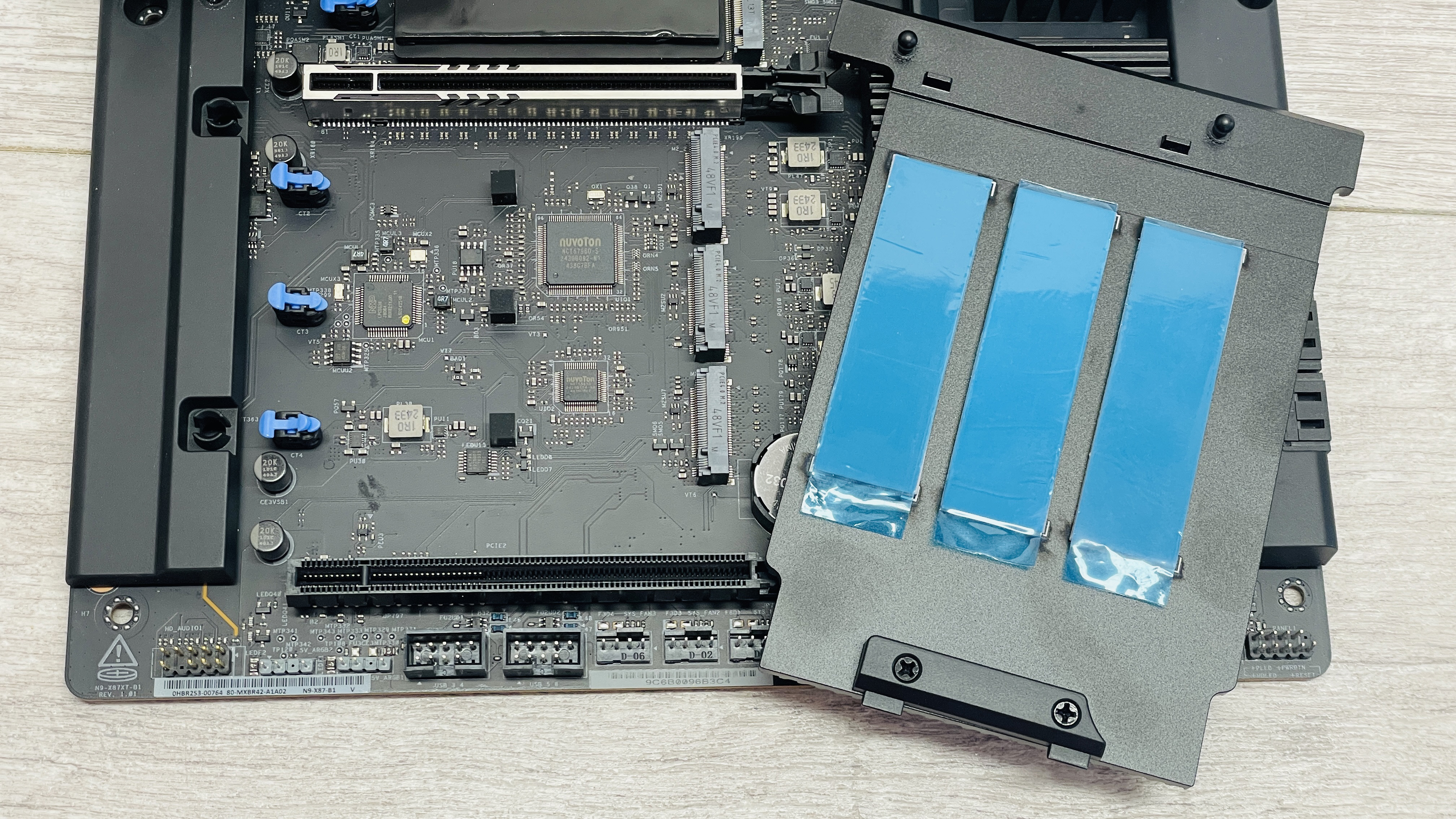 An NZXT N9 X870E motherboard in black with the port covers removed.