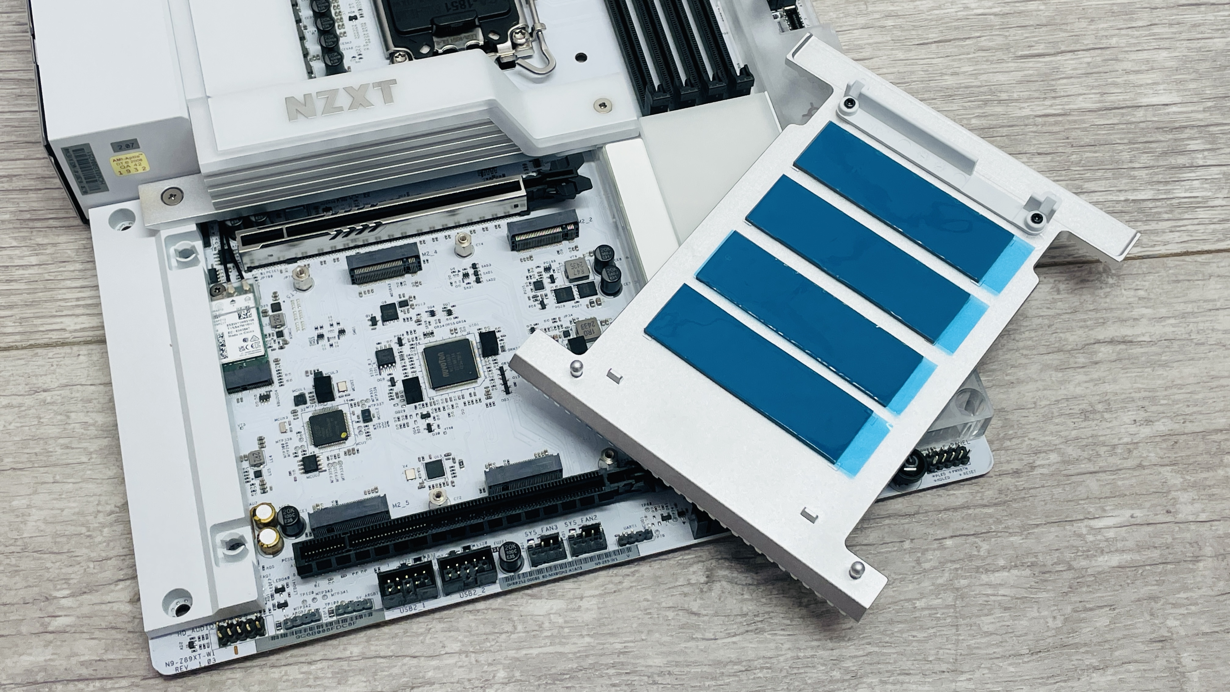 An NZXT N9 Z890 motherboard on a desk with port covers removed.