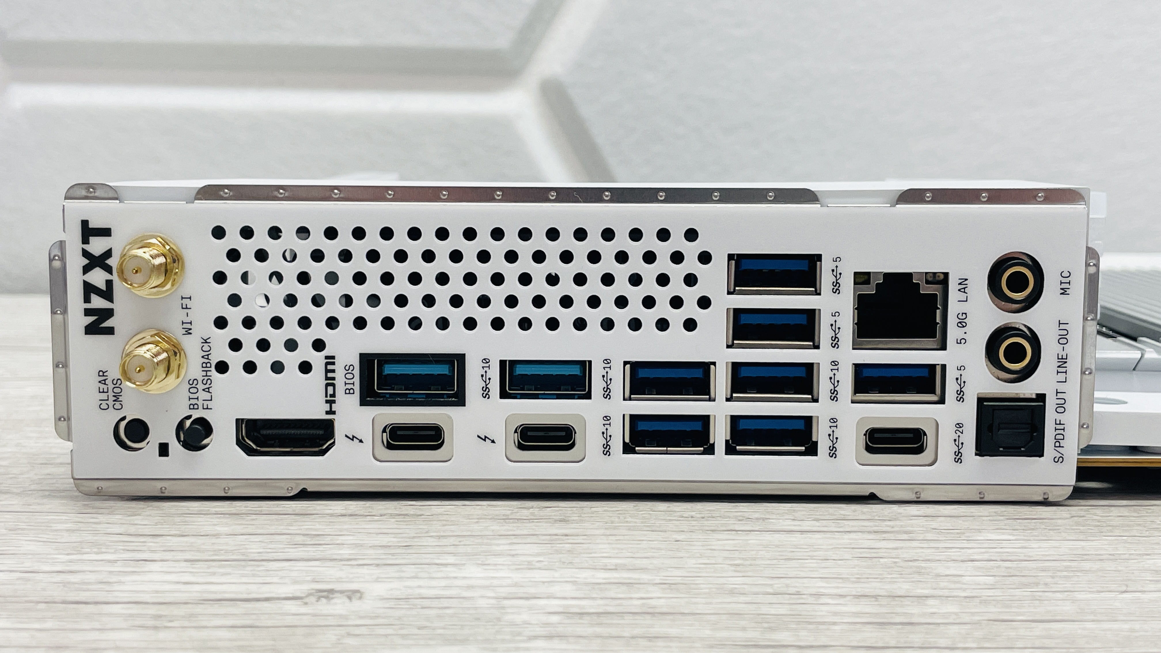 An NZXT N9 Z890 motherboard on a desk with port covers removed.