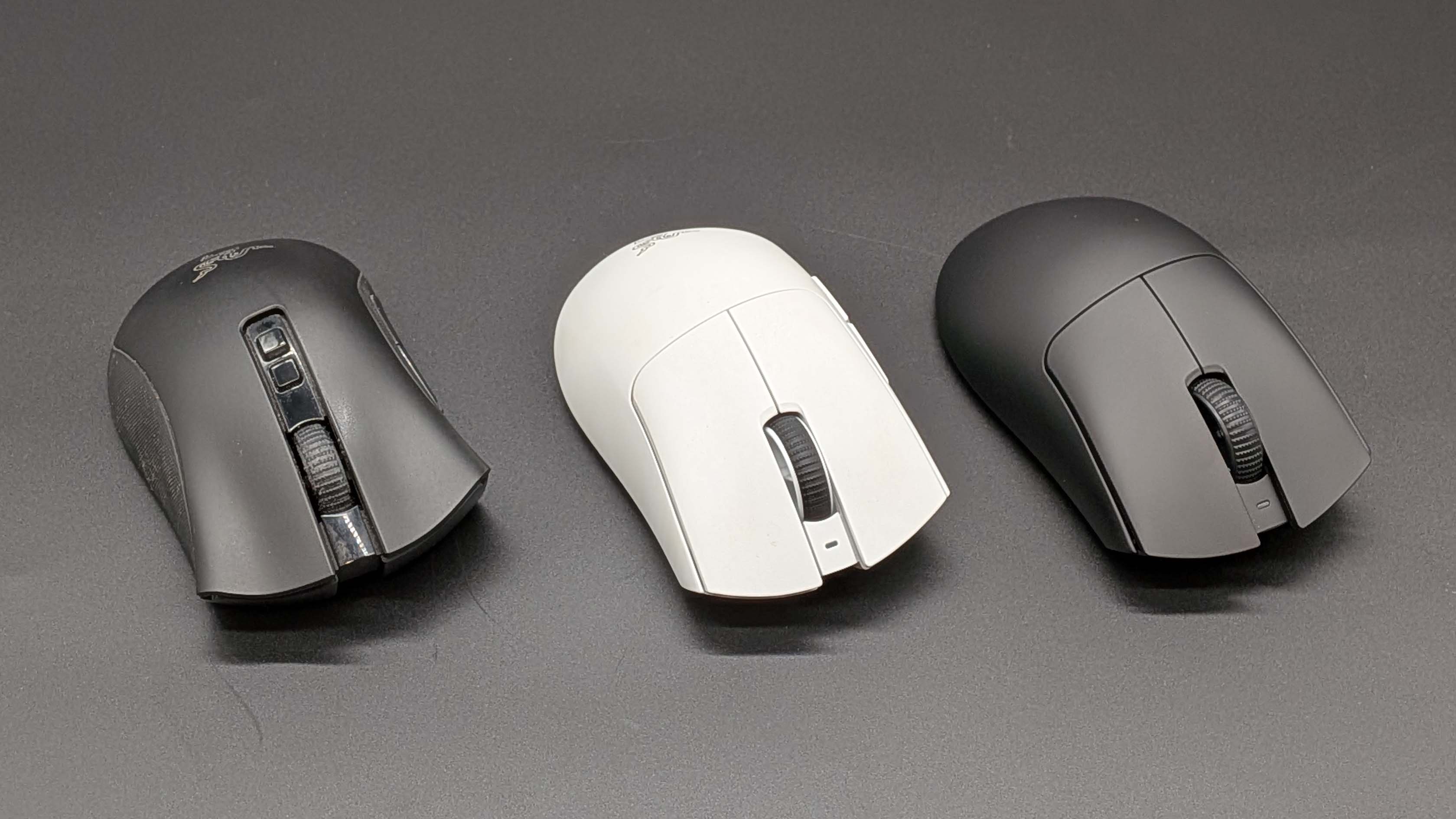 Three generations of Razer DeathAdder Pro gaming mice, from left to right, the V2 Pro, V3 Pro, and V4 Pro