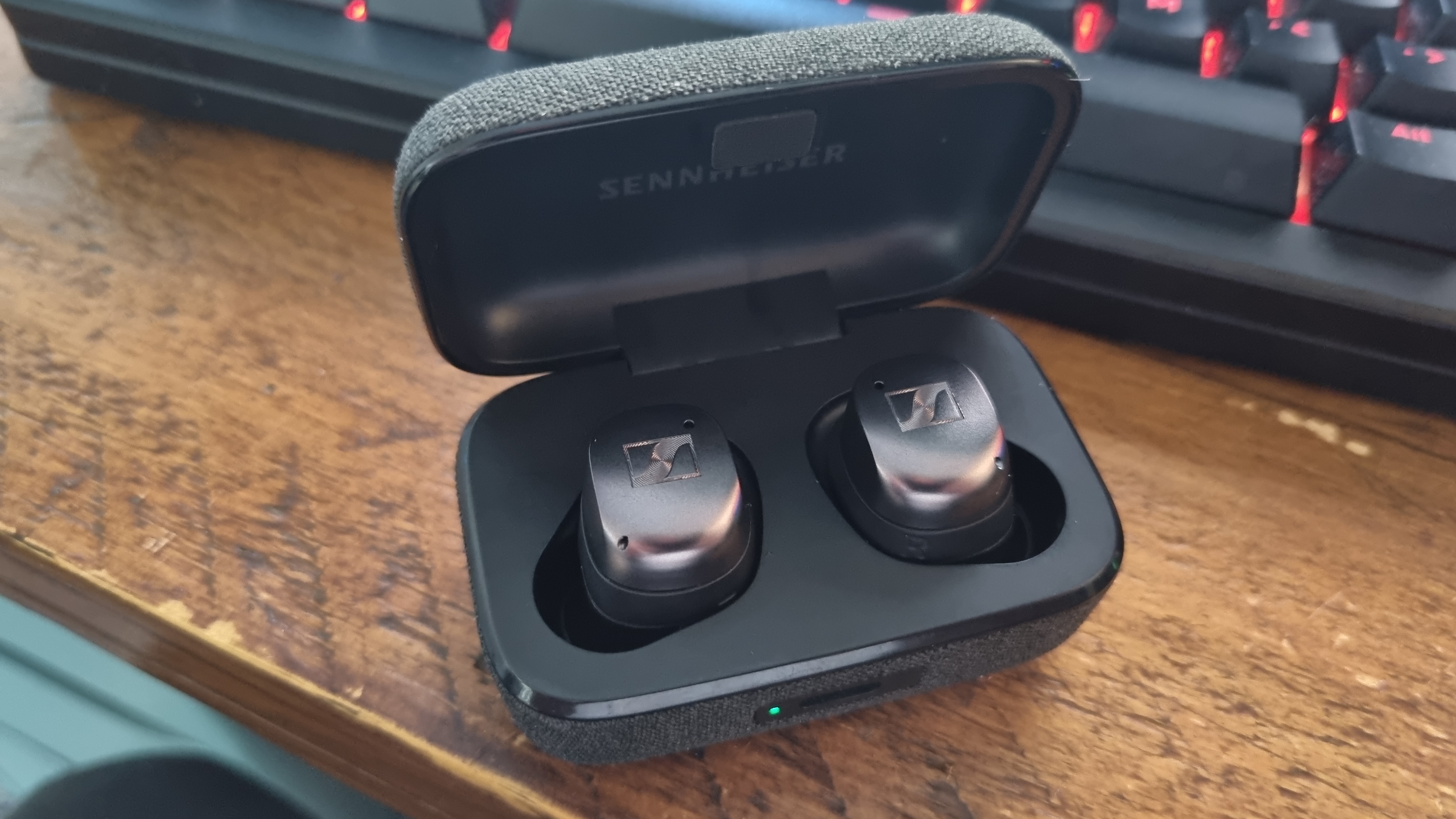 The Sennheiser Momentum True Wireless 4 earbuds in their case