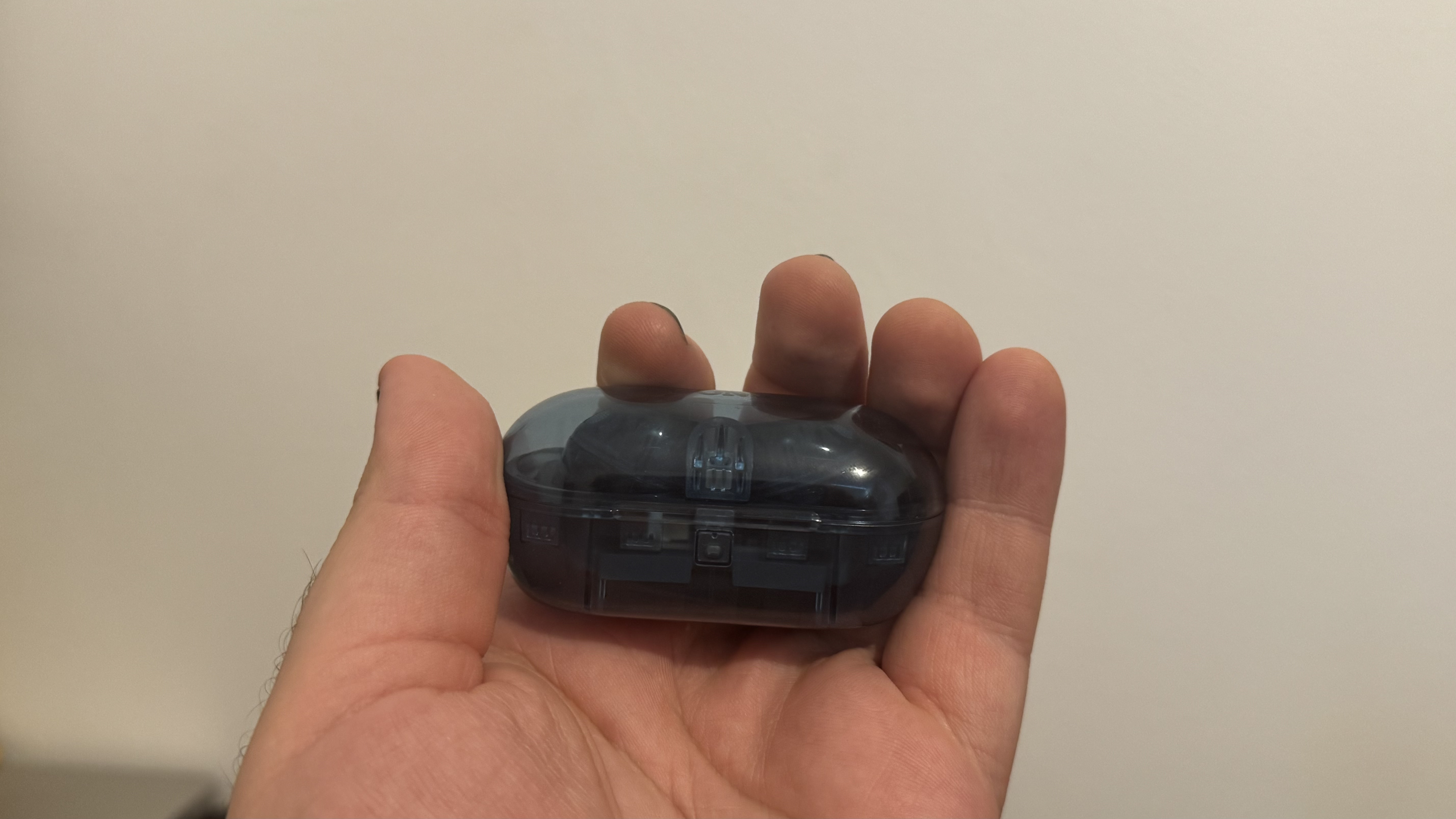 Sony WF-C710N earbuds in a hand