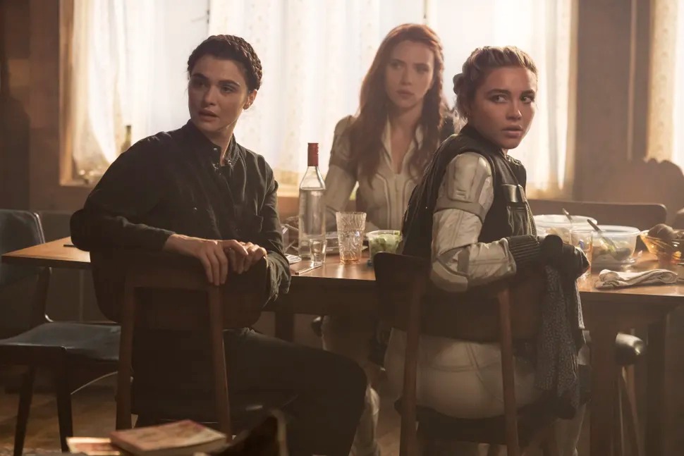 Milena (Rachel Weisz), Natasha (Scarlett Johansson), and Yelena (Florence Pugh) sit down to dinner in a contentious family scene from Marvel’s Black Widow movie. Milena (Rachel Weisz), Natasha (Scarlett Johansson), and Yelena (Florence Pugh) sit down to dinner in a contentious family scene from Marvel’s Black Widow movie.