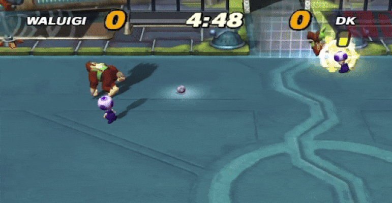 Toad rams Donkey Kong into an electrified field in Super Mario Strikers