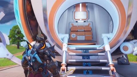 A Fortnite player in the Omega Knight skin standing outside an Academy Tech Lab