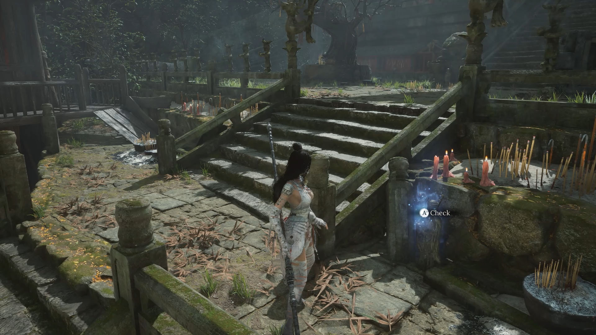 A Wuchang: Fallen Feathers screenshot showing the main character facing a small statue emitting a light-blue glow.