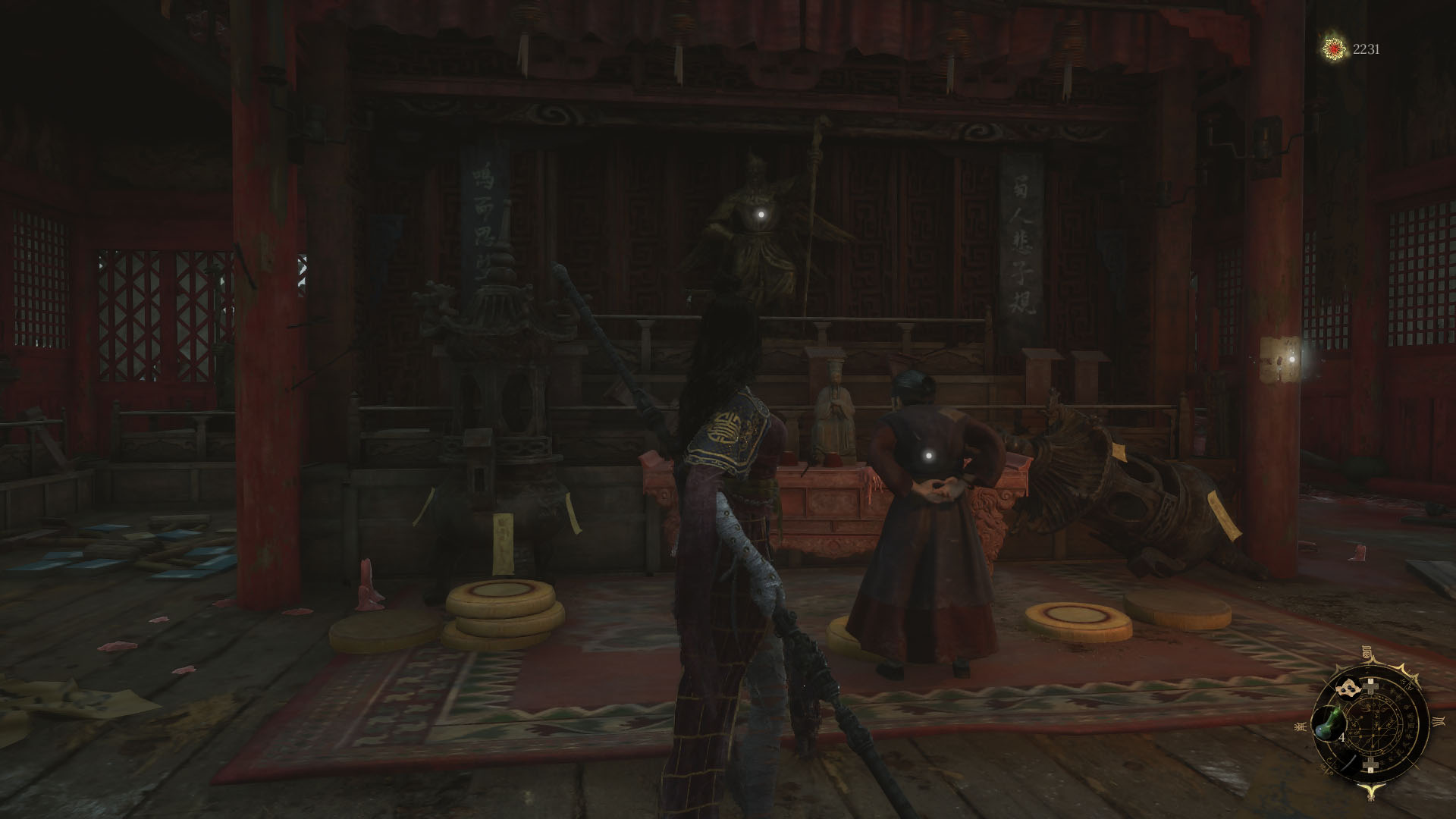 A Wuchang: Fallen Feathers screenshot showing the main character next to an old woman. Both are looking at a statue of a man holding a staff.