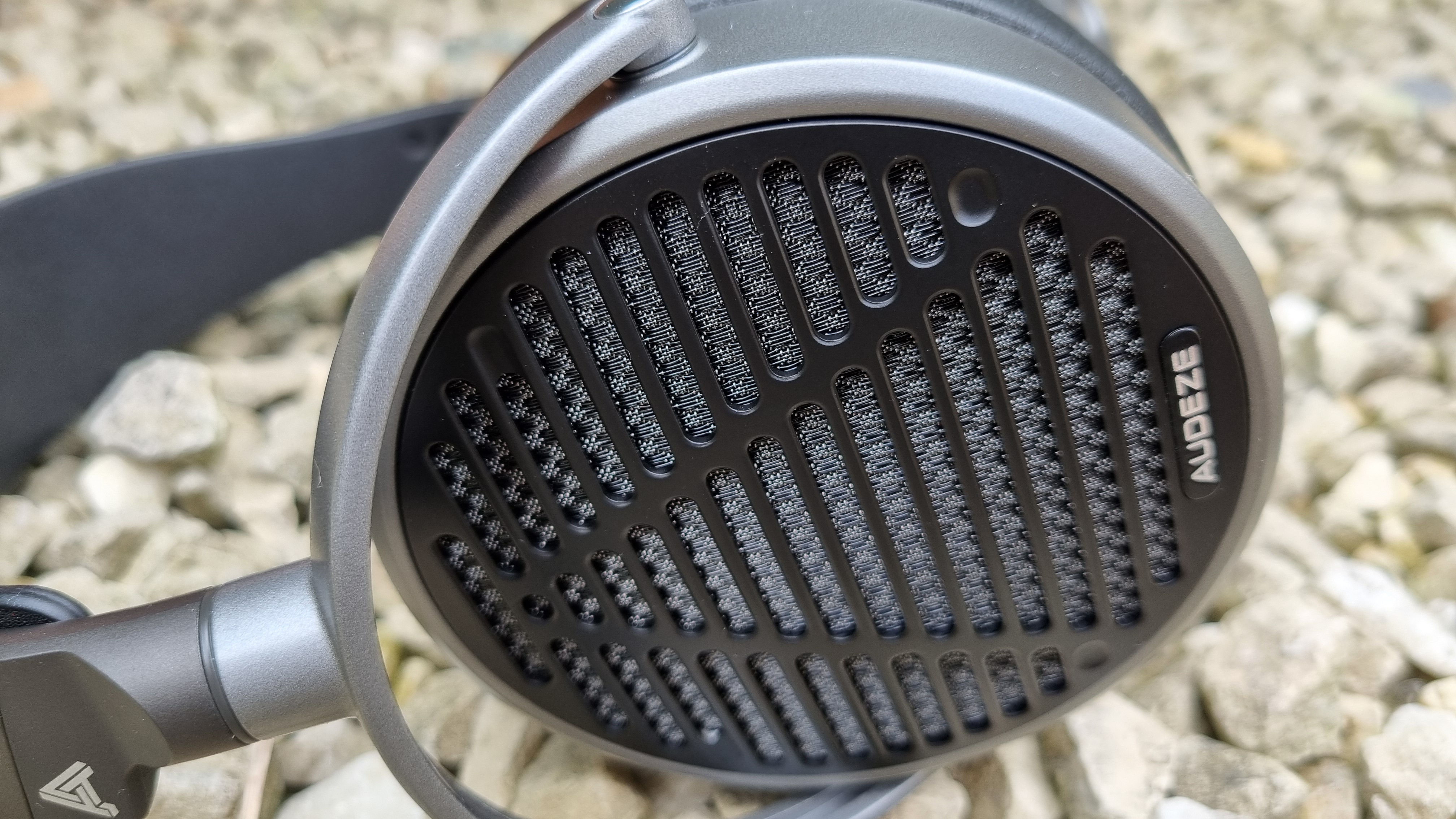The outer, grilled earcups of the Audeze MM-100