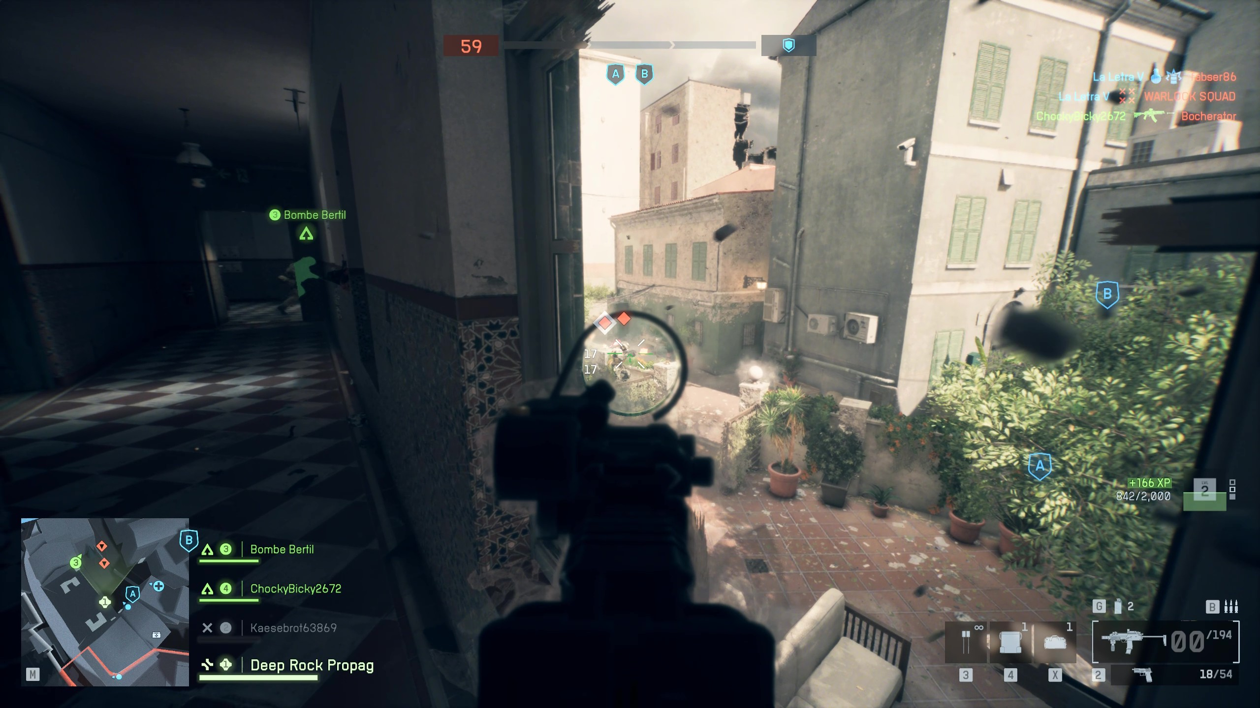 Battlefield 6 spotting: A player aiming an SMG through a window down at enemies in the courtyard below.