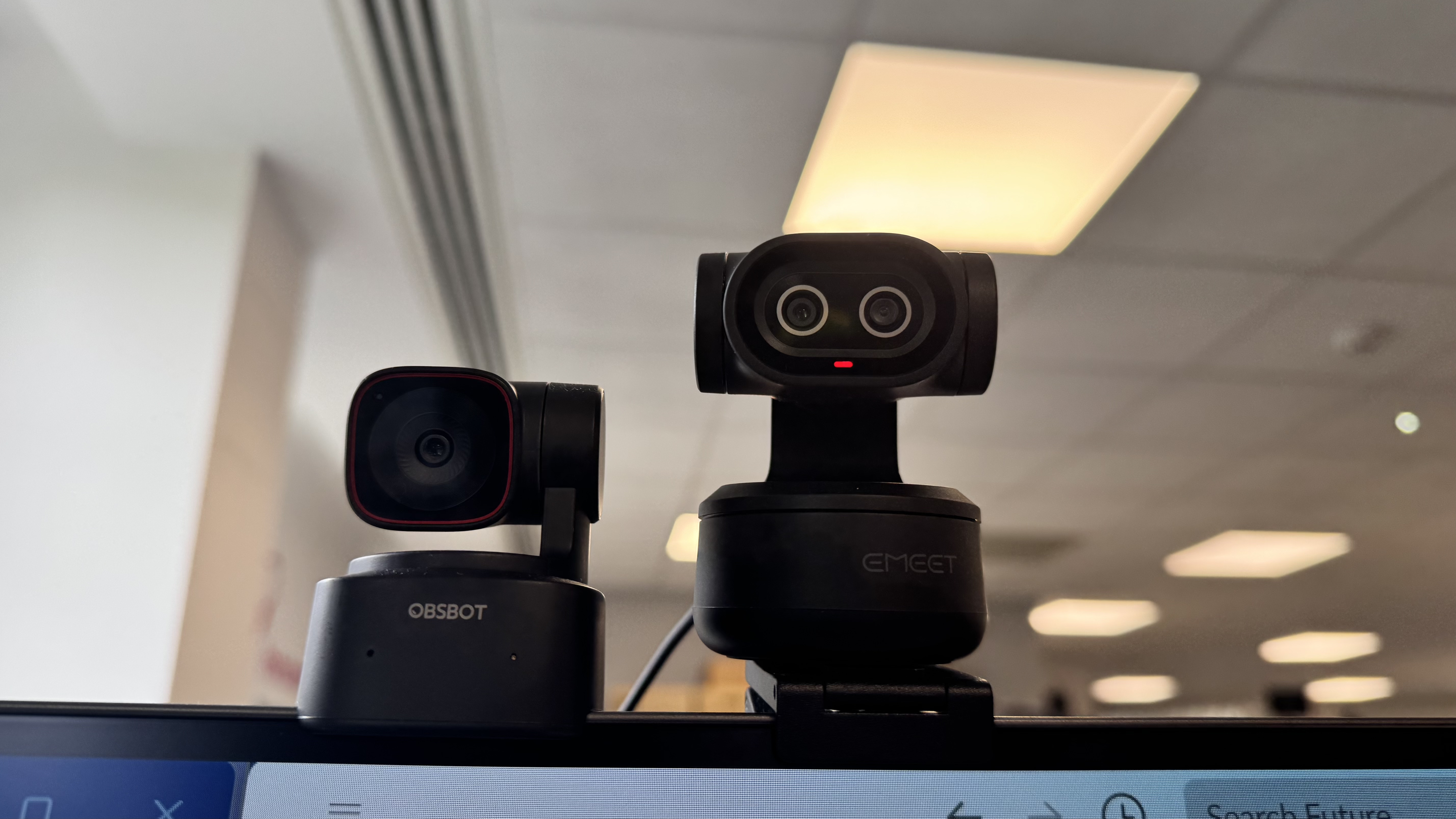 A side by side comparison of the Obsbot Tiny 2 Lite and the Emeet Pixy