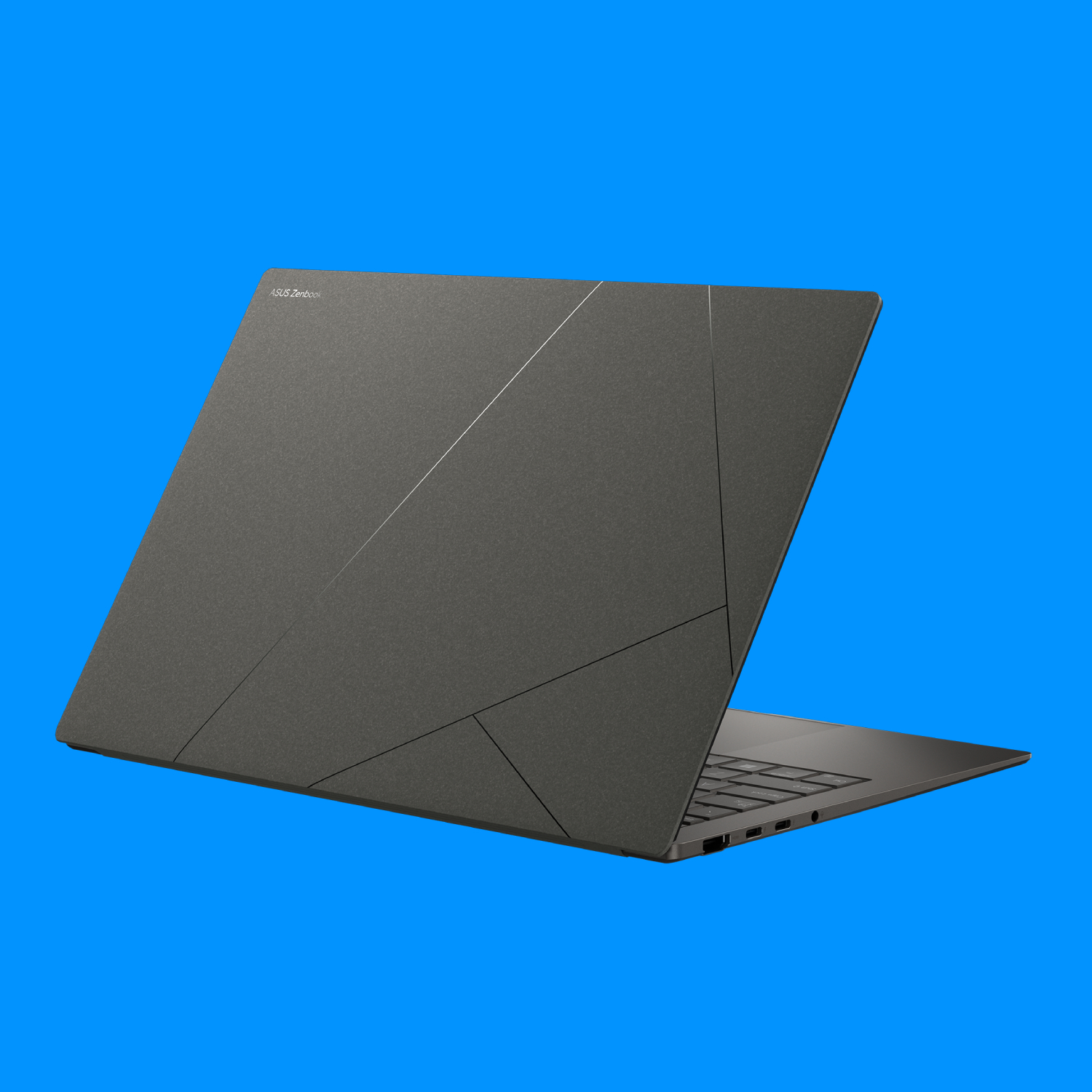 The Asus Zenbook S 14 on a blue background, with the rear lid on display
