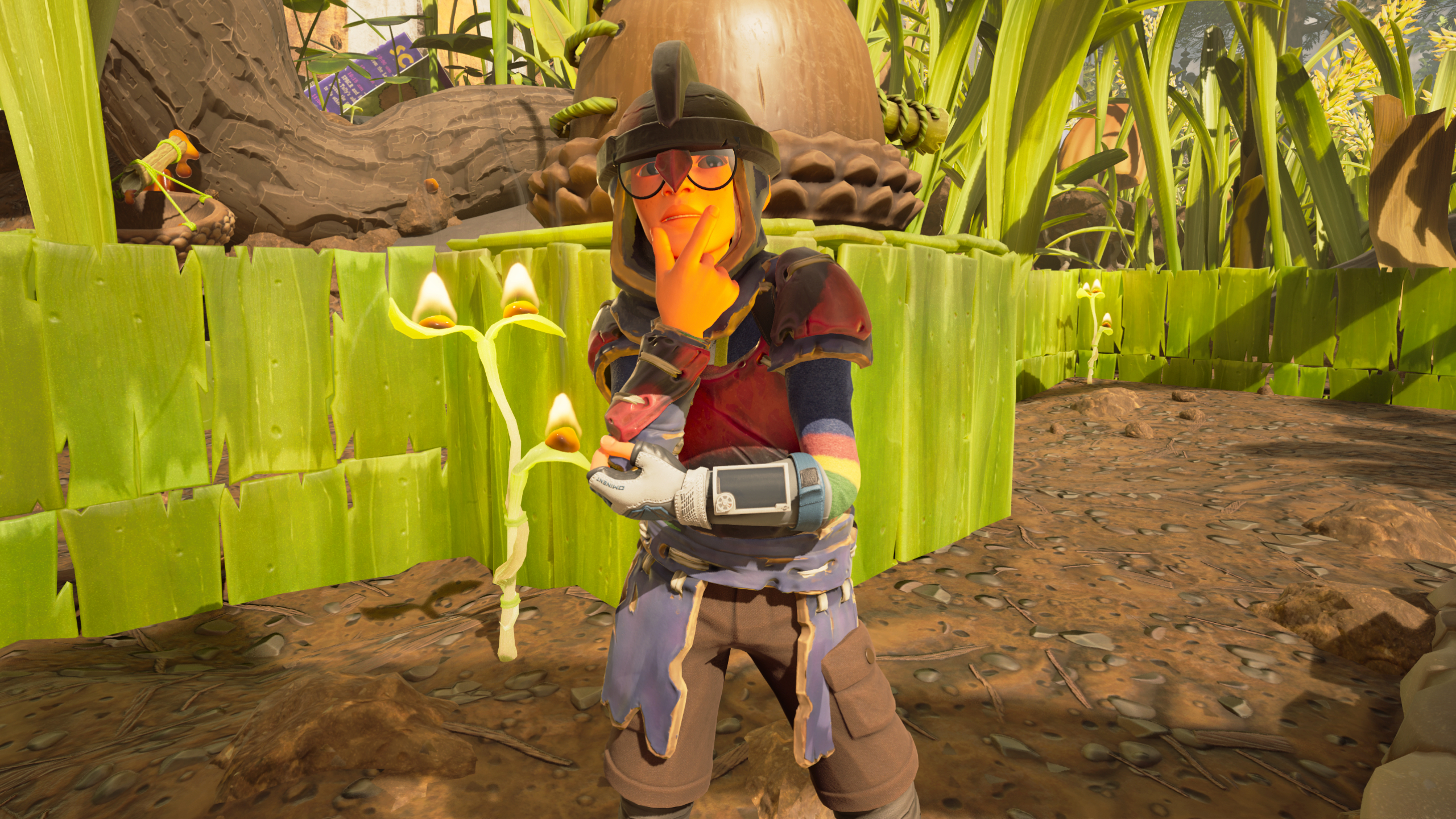 Best Grounded 2 base locations: A character wearing armour and a helmet with their hand up to their chin, standing next to a base wall made of grass.