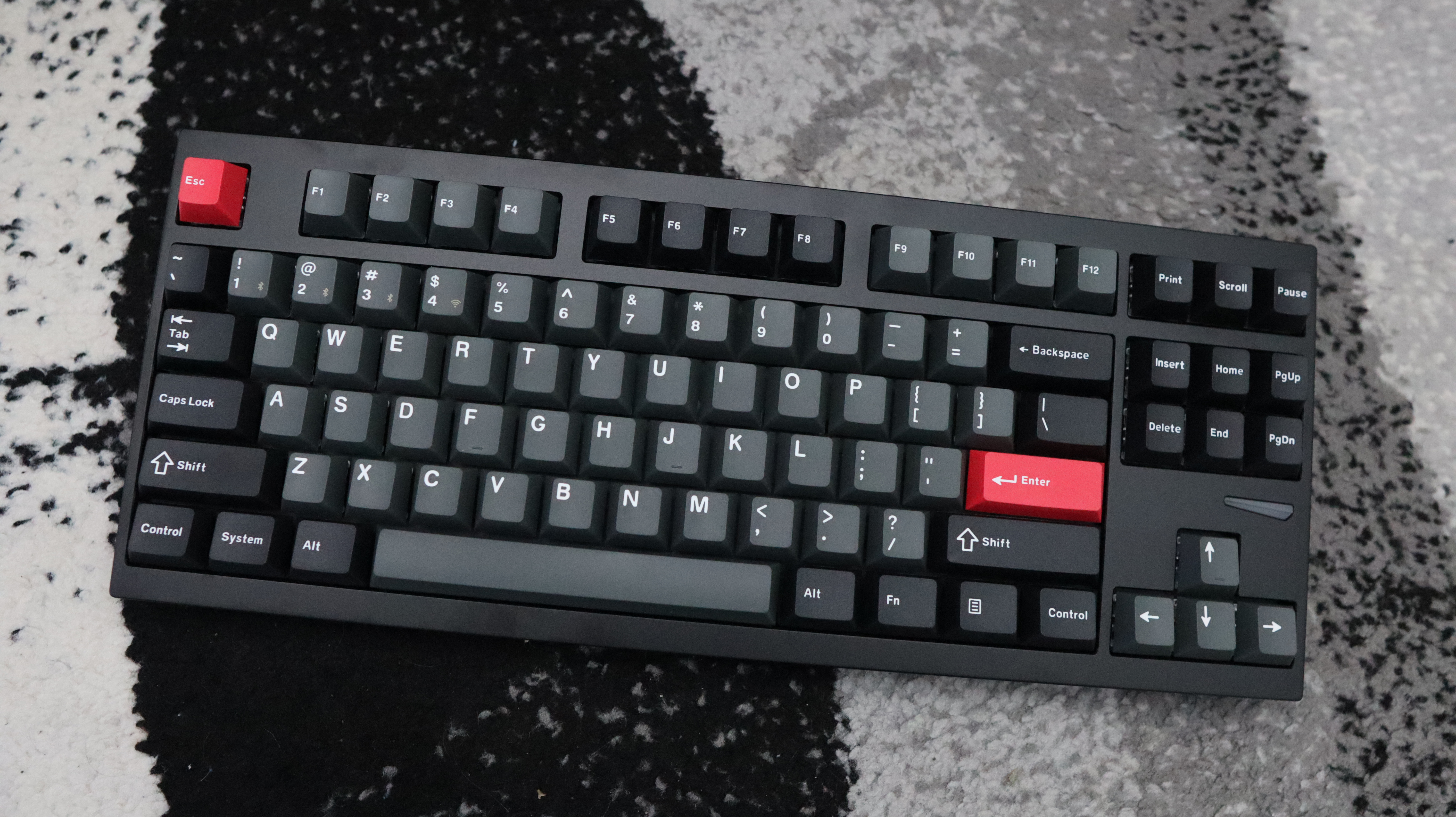 Lemokey L4 gaming keyboard on a carpet with lighting enabled.