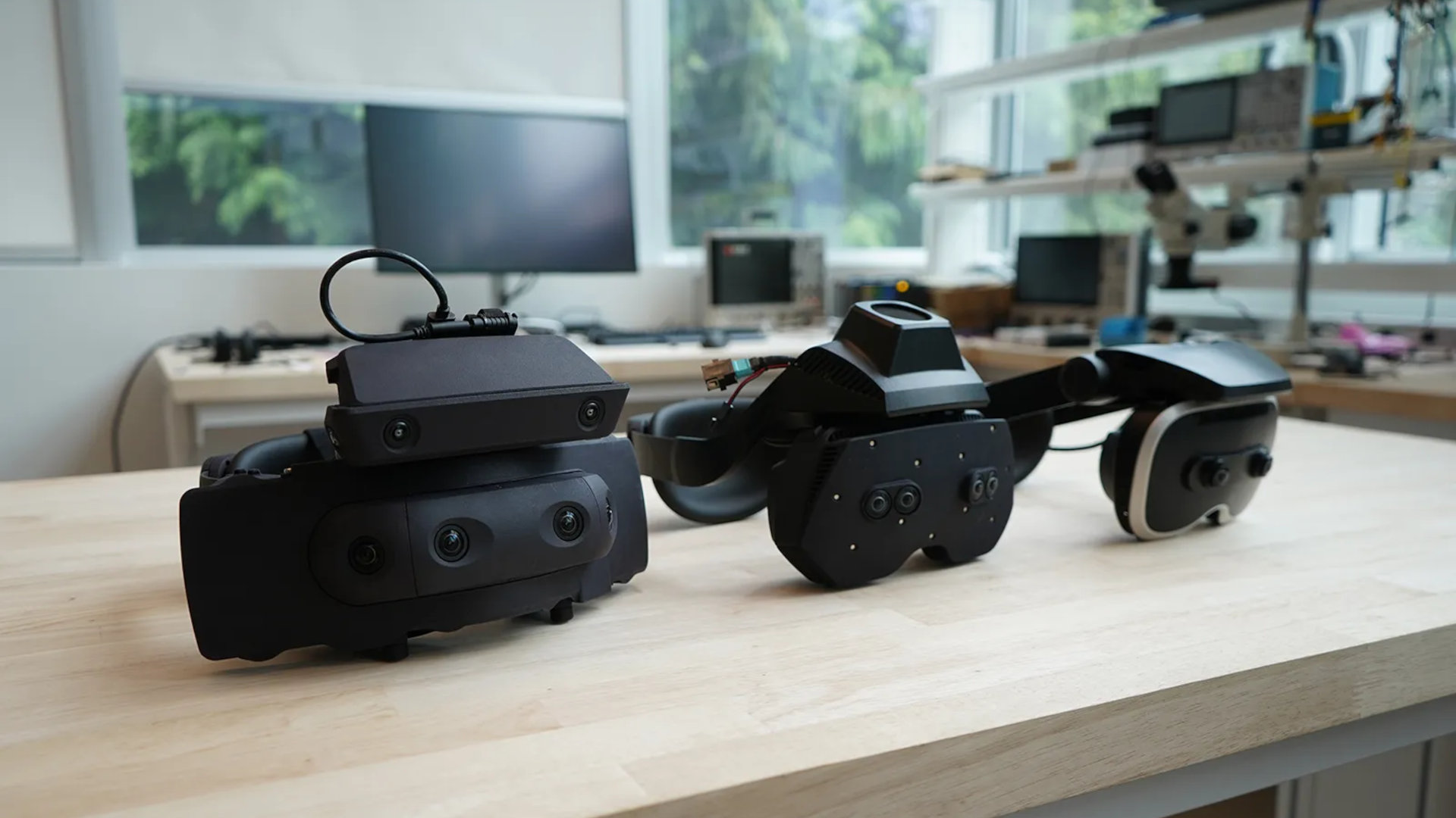 Three Meta VR prototype headsets—Boba 1, Boba 2, and Boba 3—arranged in a line on a table.
