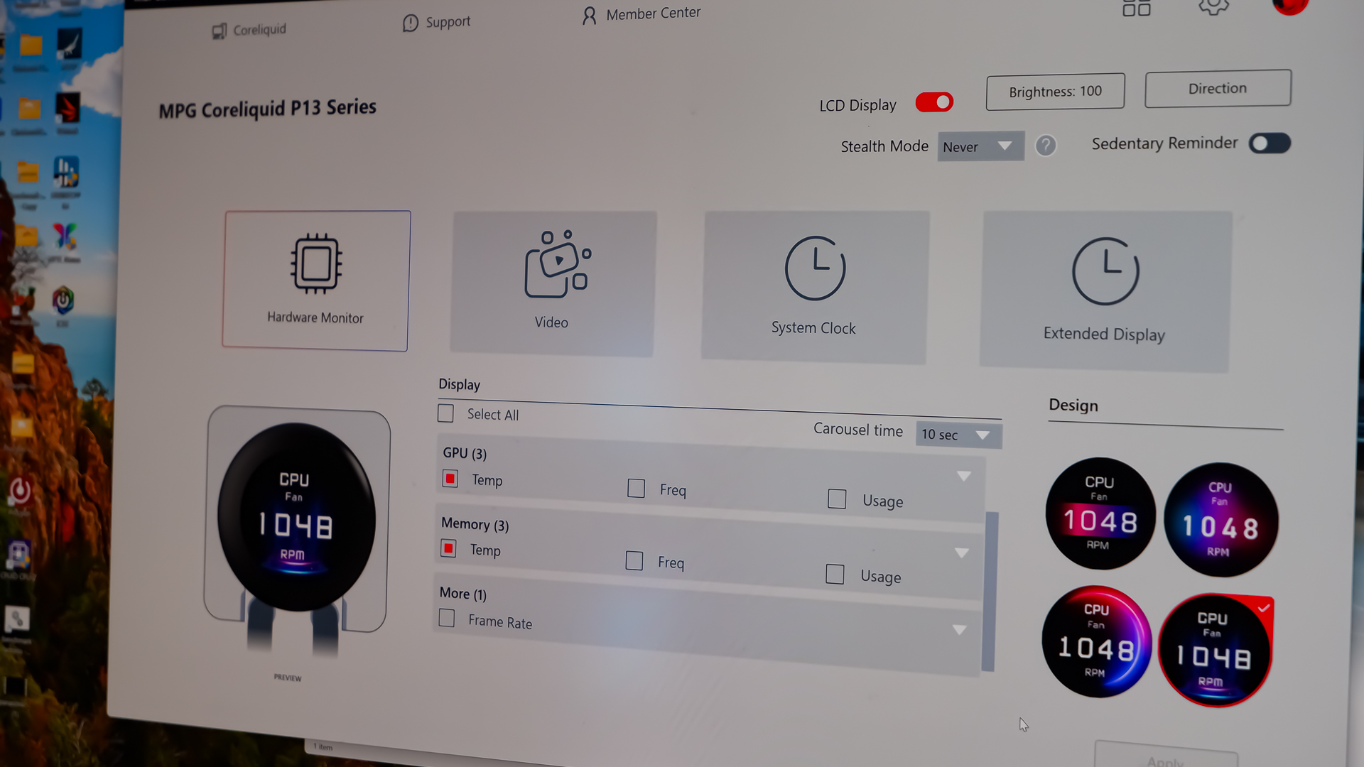 An MSI MPG CoreLiquid P13 all-in-one liquid cooler on a desk and installed onto a test bench for testing.