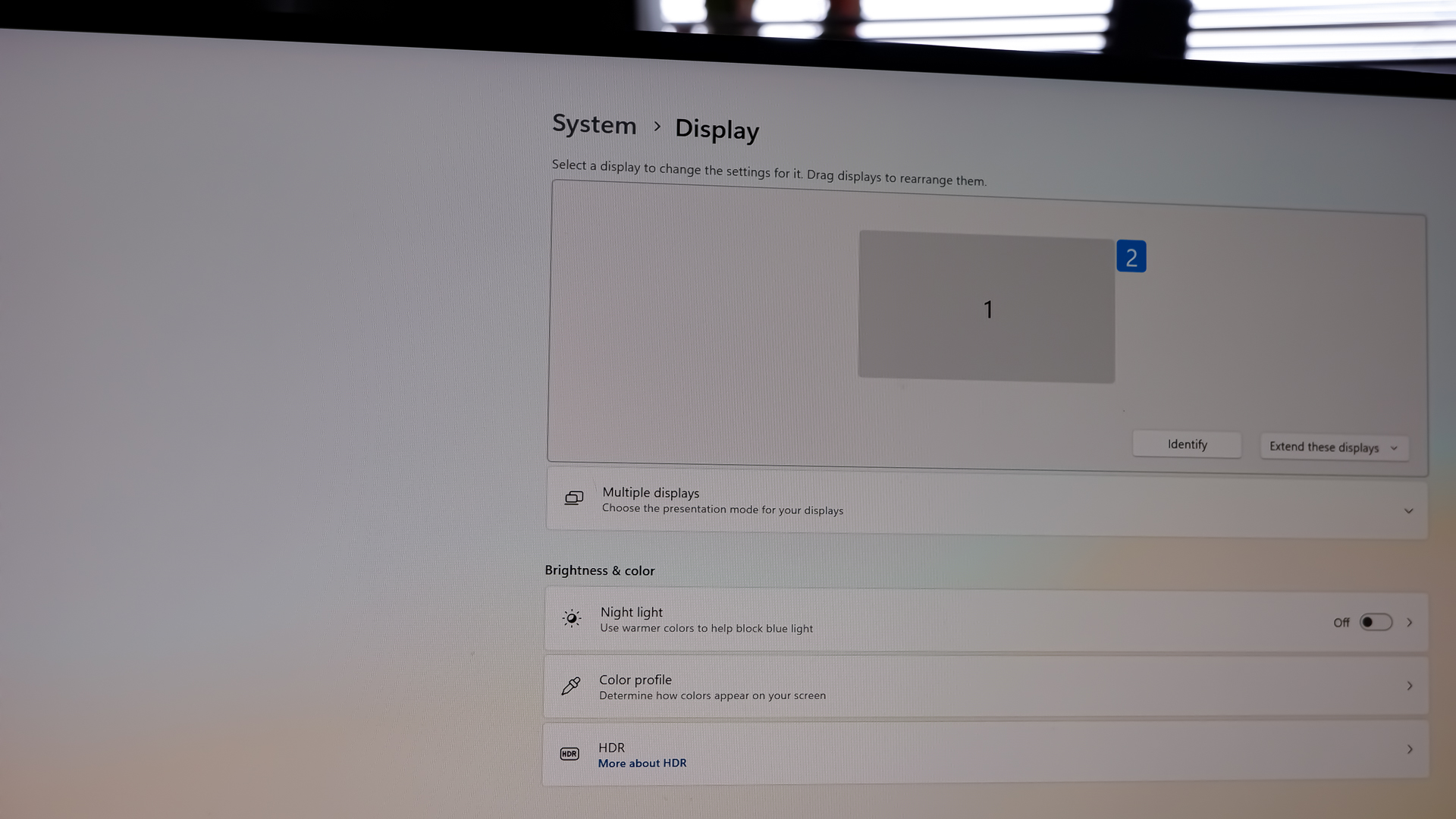 An MSI MPG CoreLiquid P13 all-in-one liquid cooler on a desk and installed onto a test bench for testing.