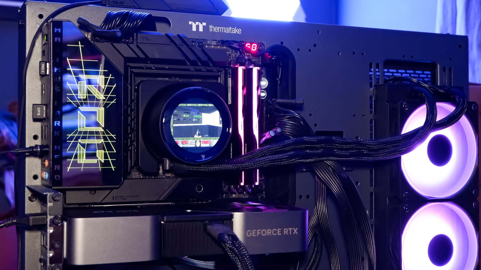 An MSI MPG CoreLiquid P13 all-in-one liquid cooler on a desk and installed onto a test bench for testing.