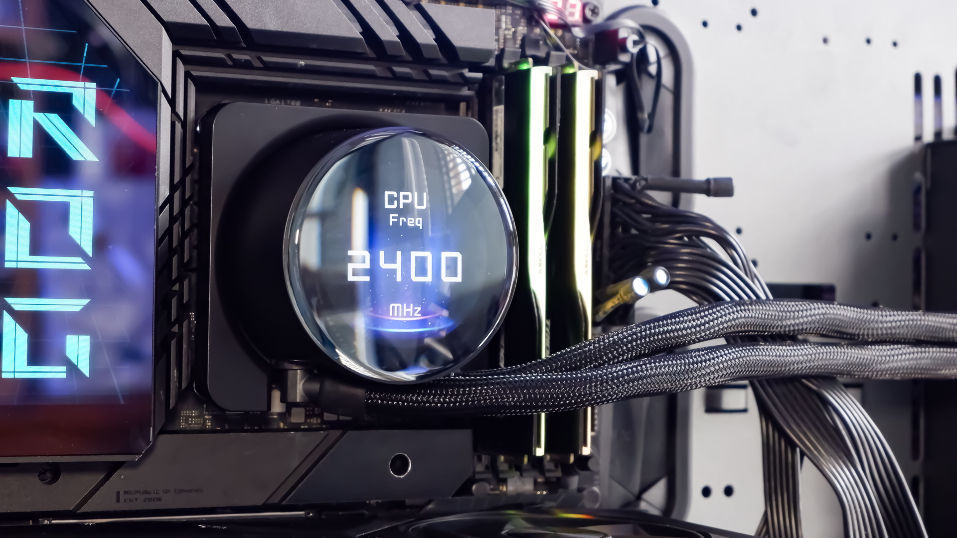 An MSI MPG CoreLiquid P13 all-in-one liquid cooler on a desk and installed onto a test bench for testing.
