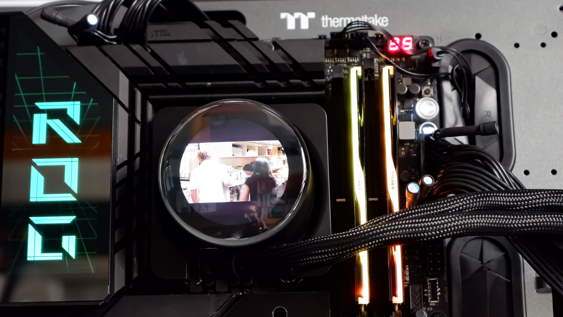 An MSI MPG CoreLiquid P13 all-in-one liquid cooler on a desk and installed onto a test bench for testing.