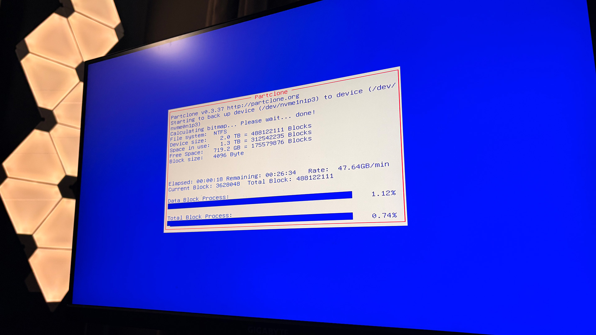 A photo of the Clonezilla cloning process with information about how the process is going on-screen