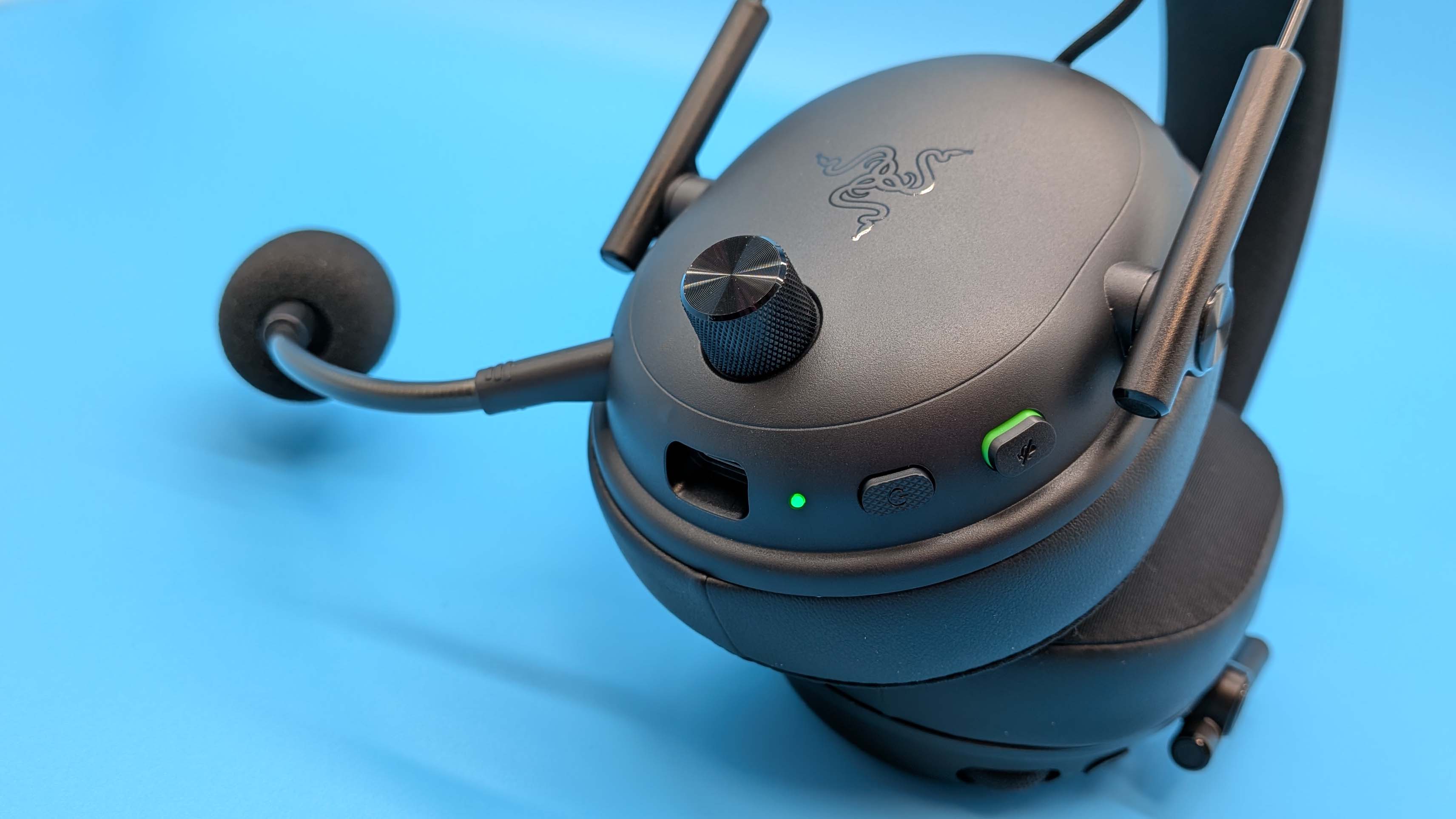 Razer BlackShark V3 gaming headset on a blue blackground