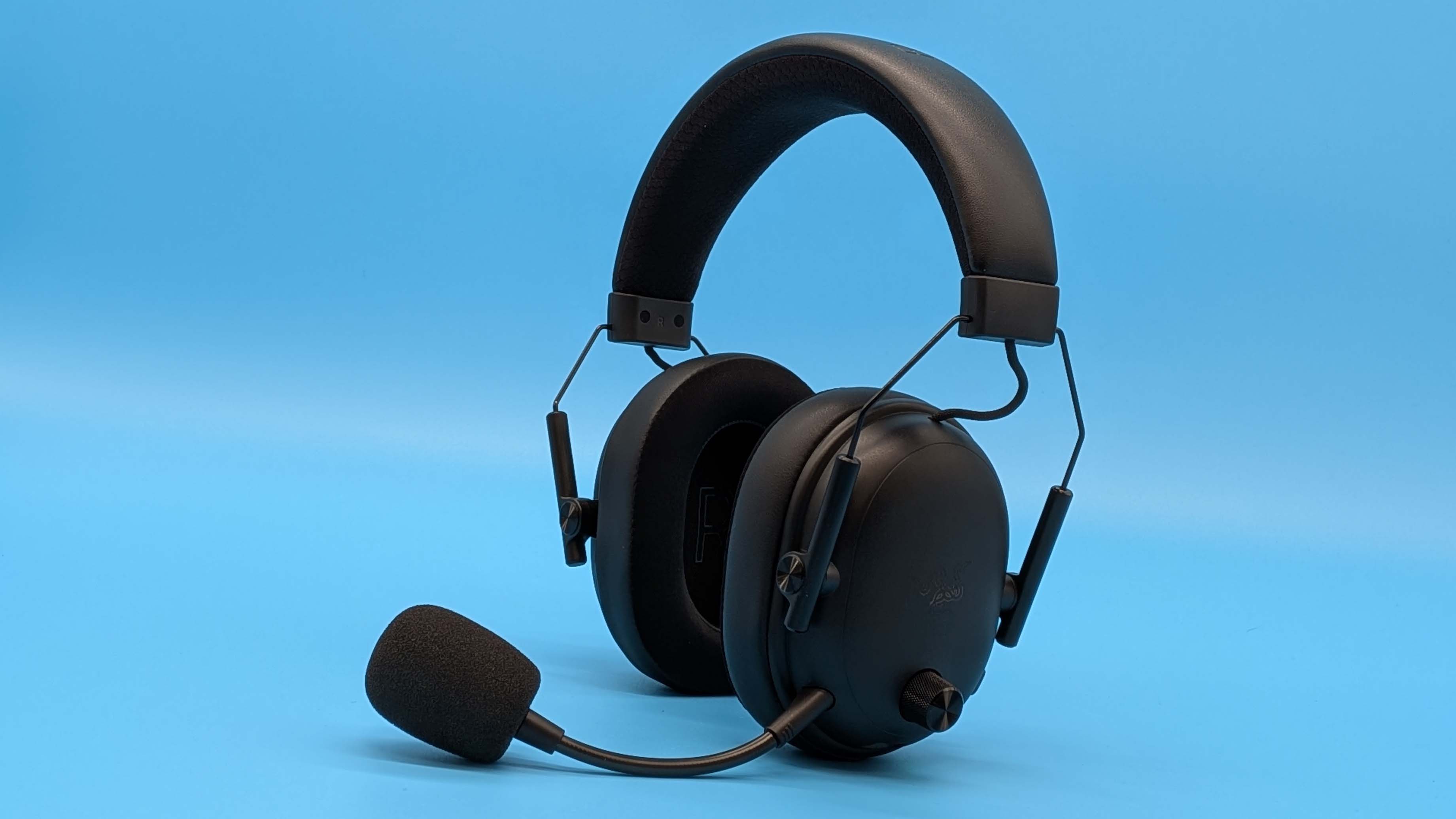 Razer BlackShark V3 gaming headset on a blue blackground