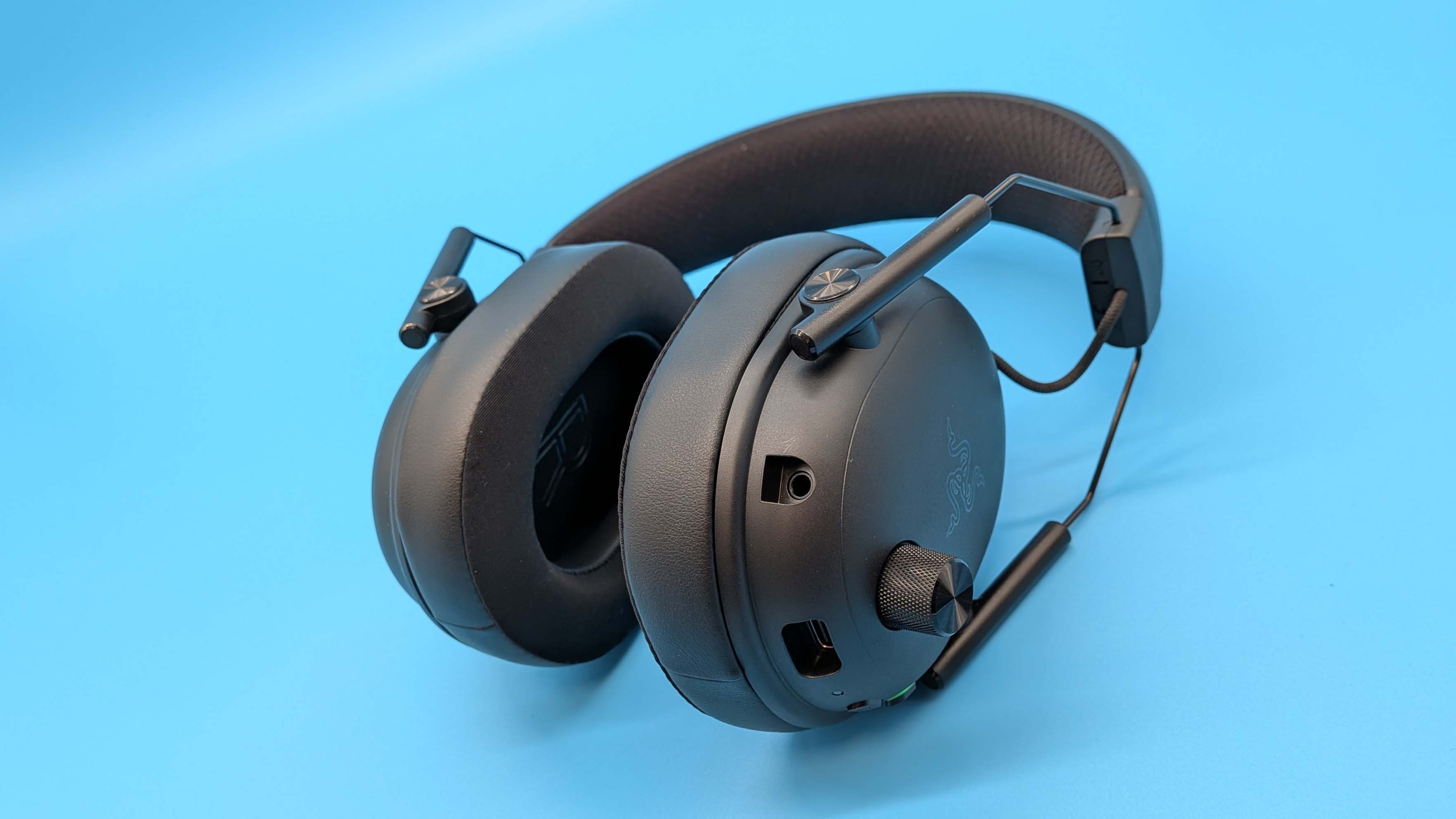 Razer BlackShark V3 gaming headset on a blue blackground