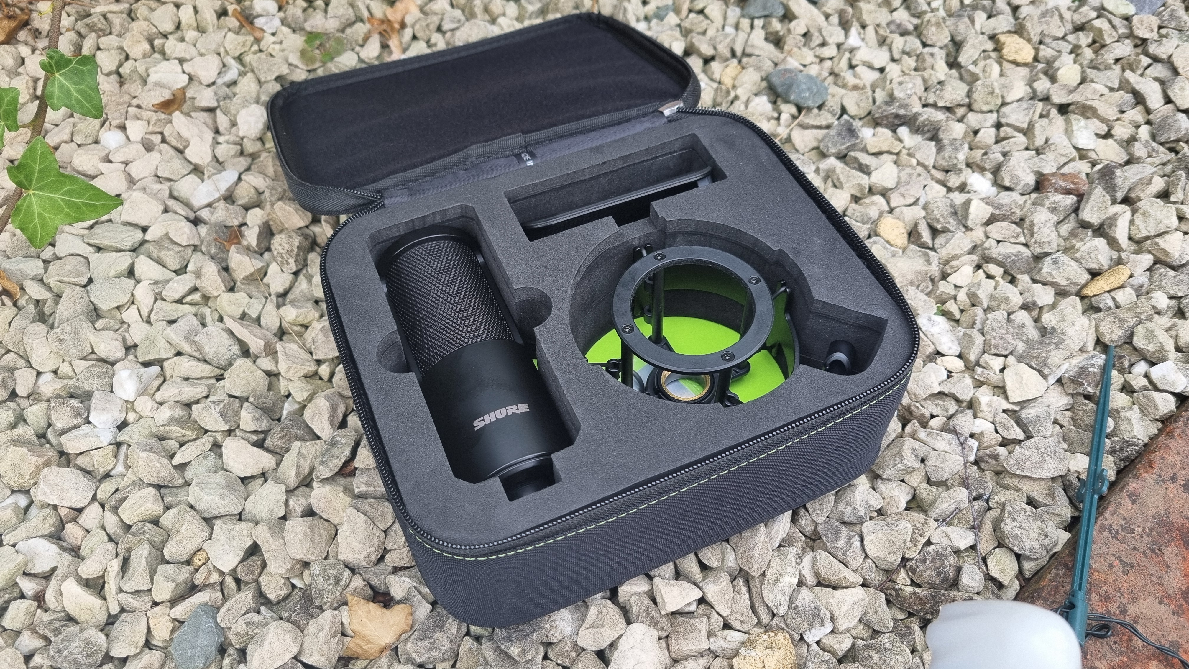The Shure SM4 Studio Kit, shown on a white gravel background