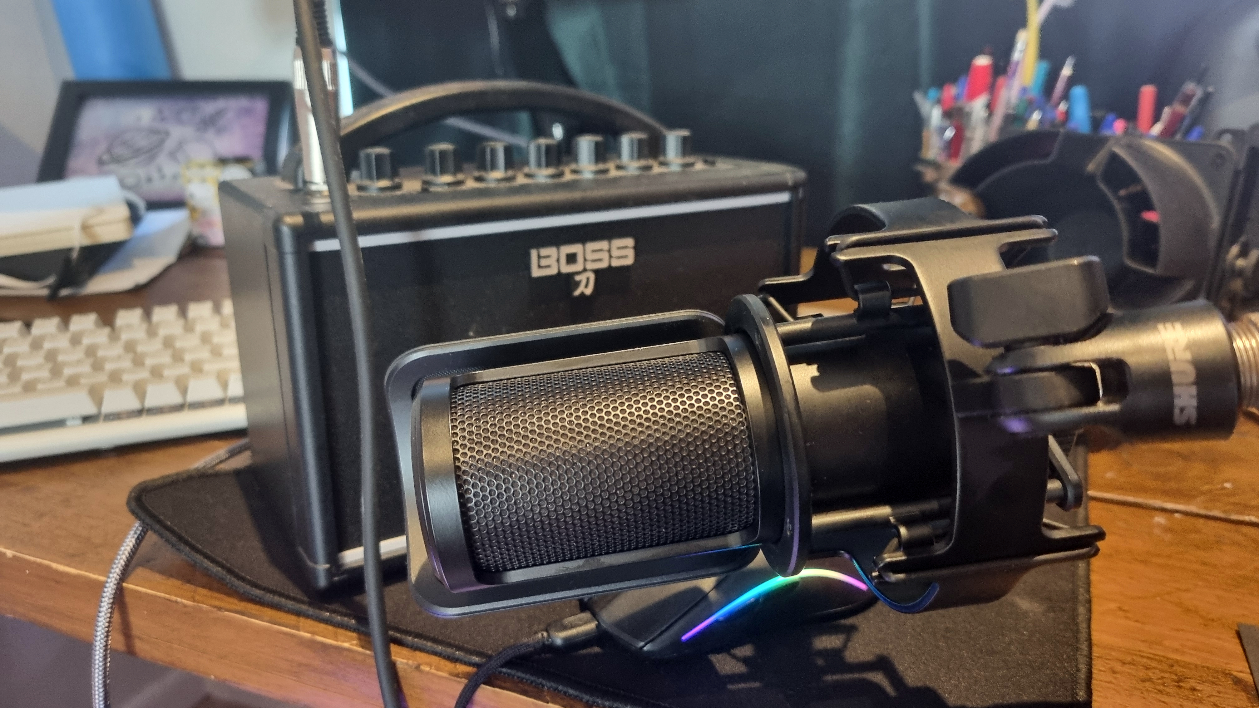 The Shure SM4 placed in front of a Boss Katana Mini guitar practice amp