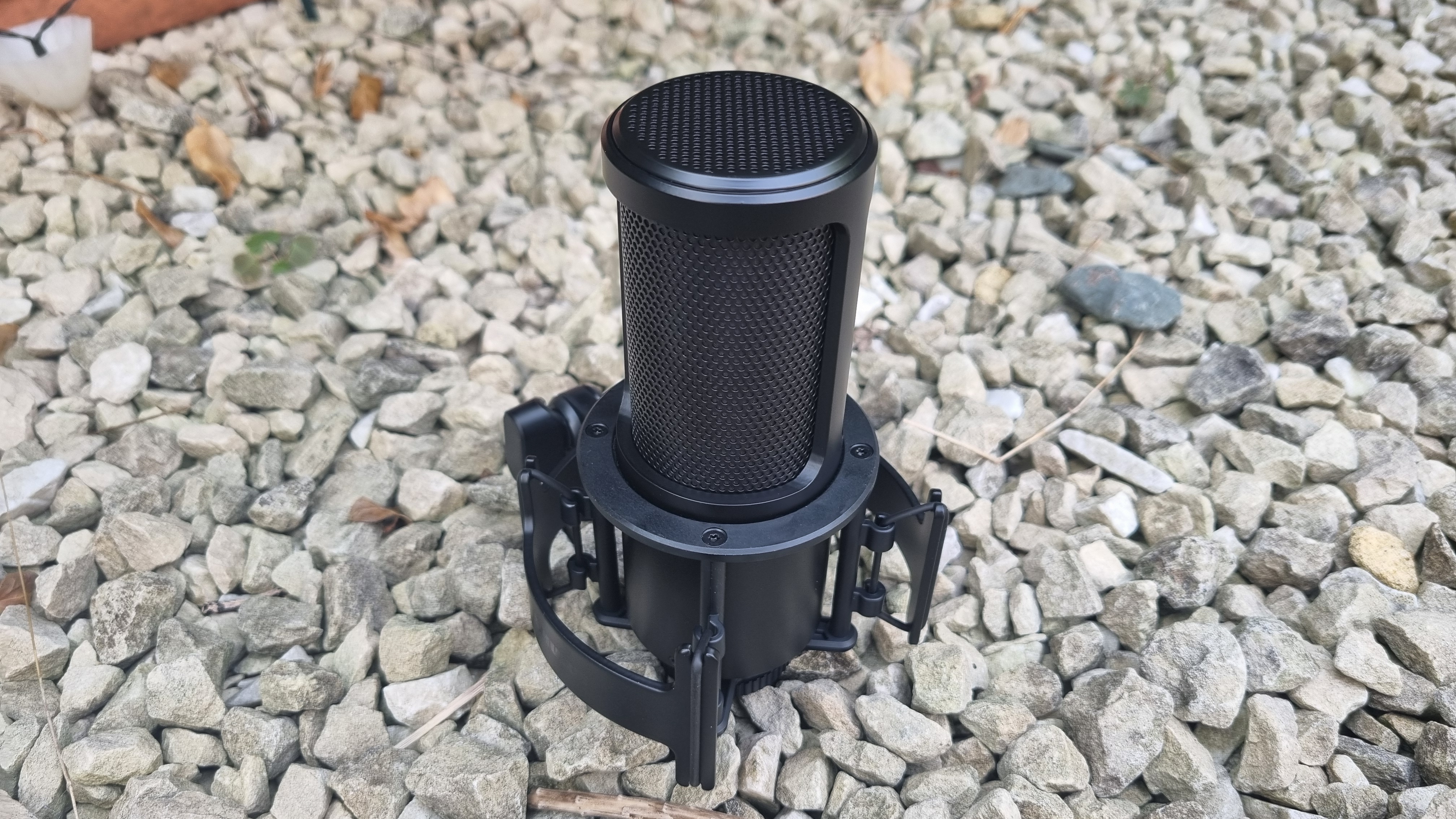 The Shure SM4 Studio Kit, shown on a white gravel background