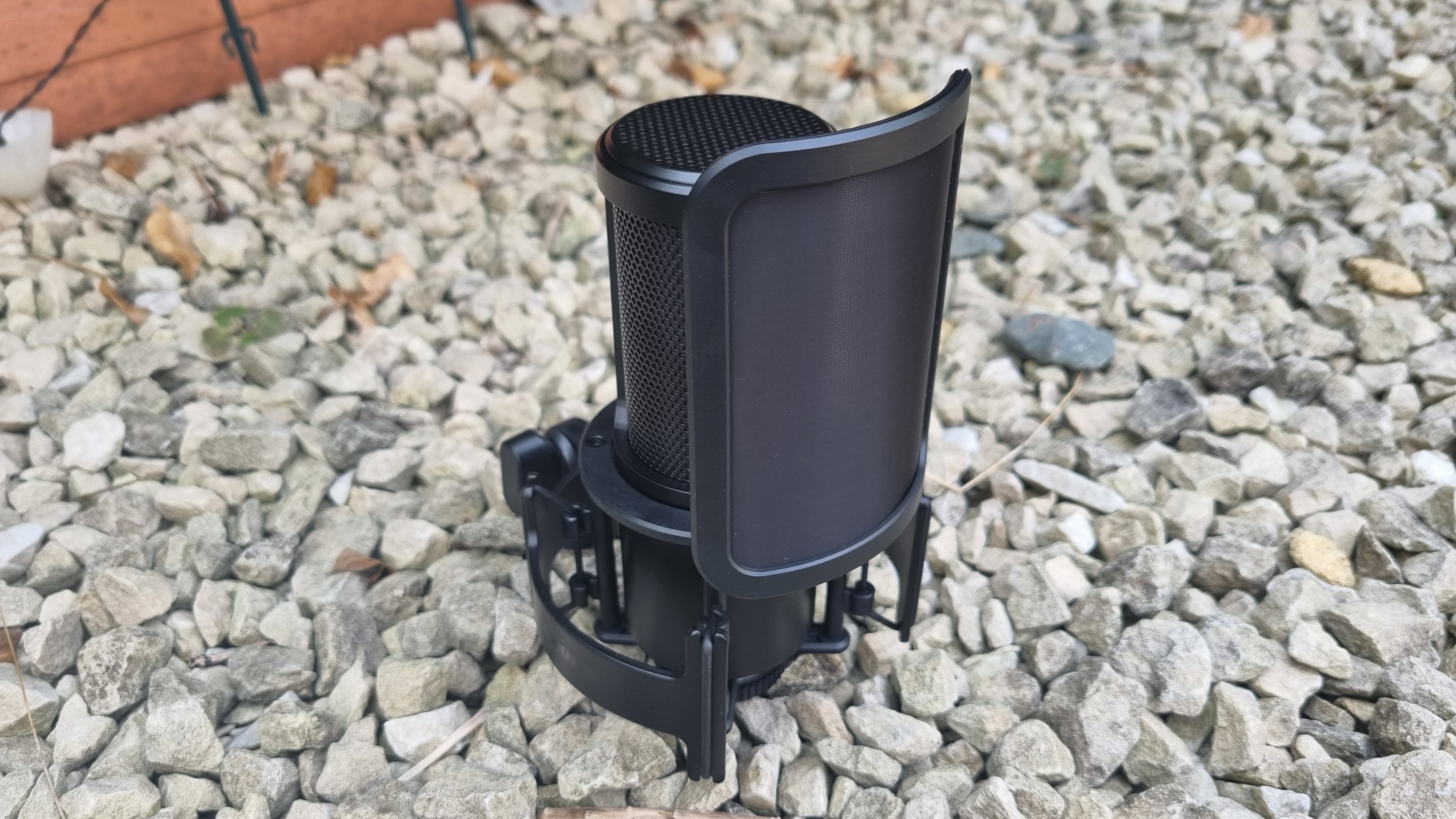 The Shure SM4 Studio Kit, shown on a white gravel background