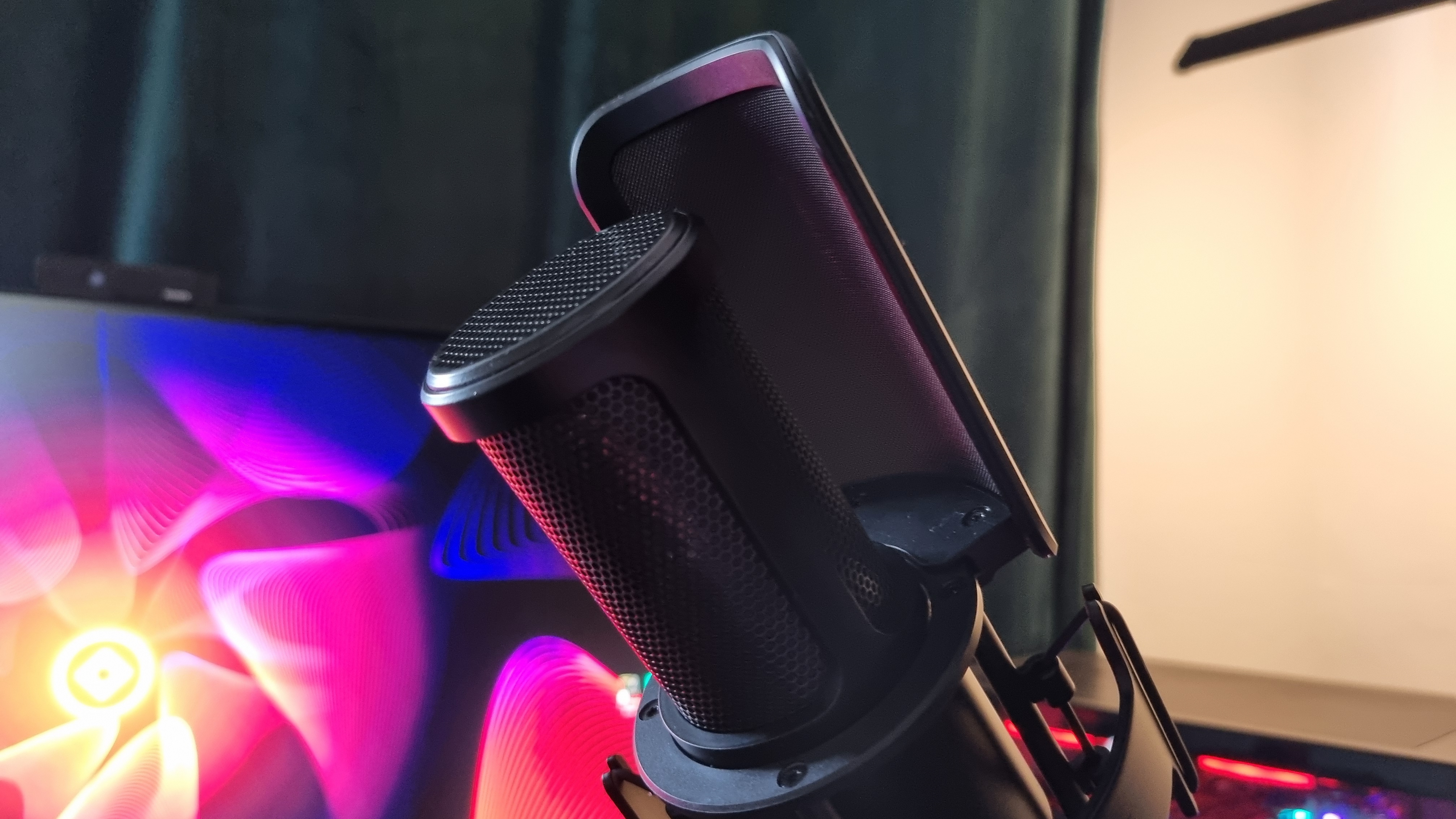 The rear of the Shure SM4 microphone, attached to a boom arm