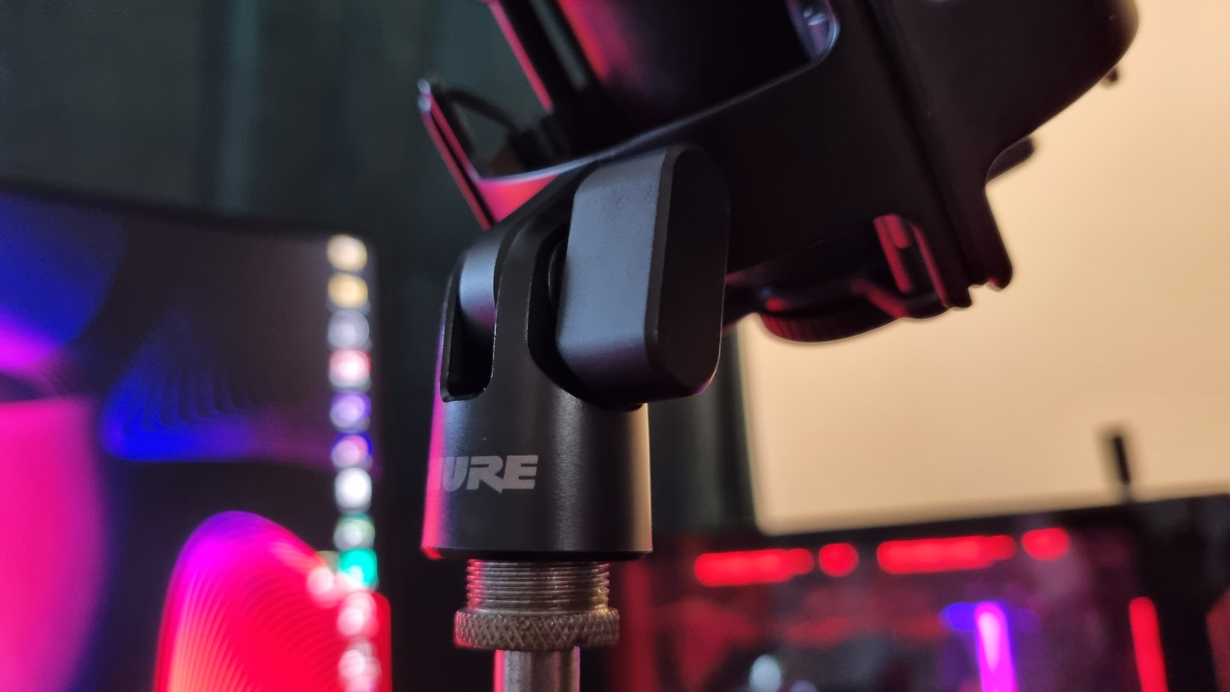 The boom arm mount of the Shure SM4 home recording microphone