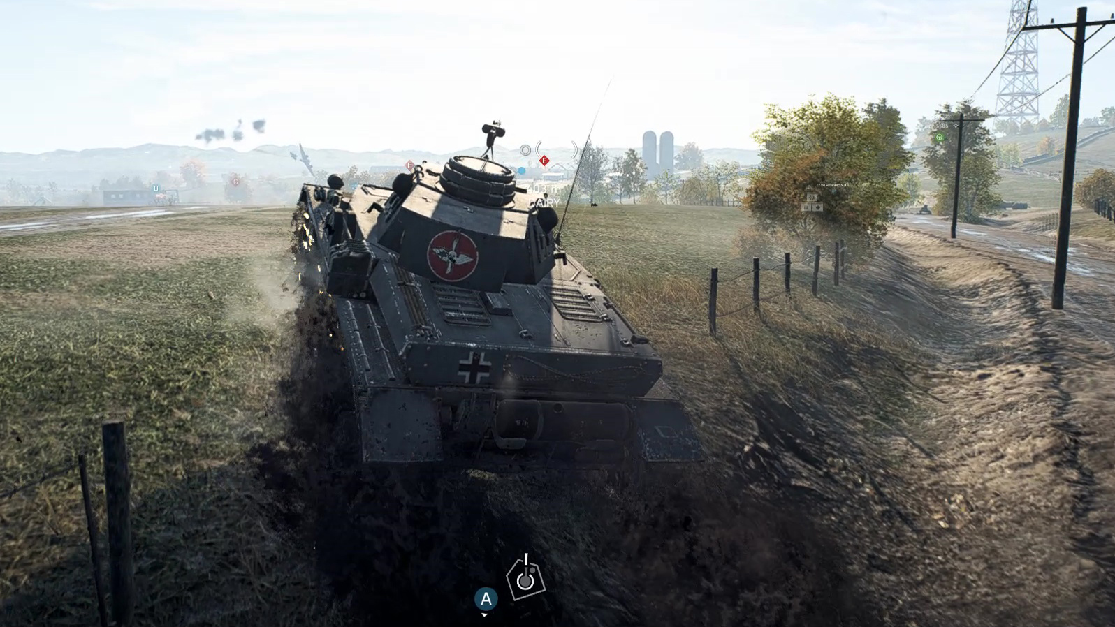 tank drives across a field