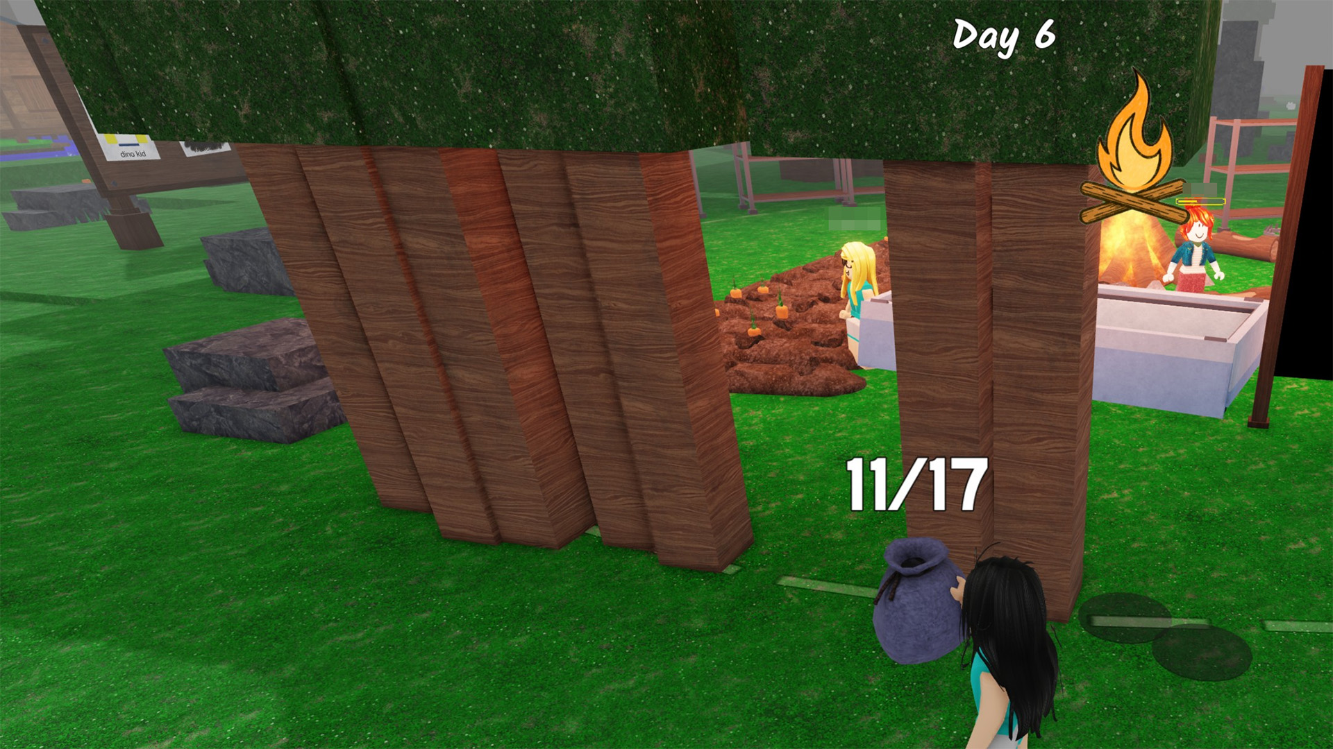 99 Nights in the Forest player planting trees around camp to create base defense.