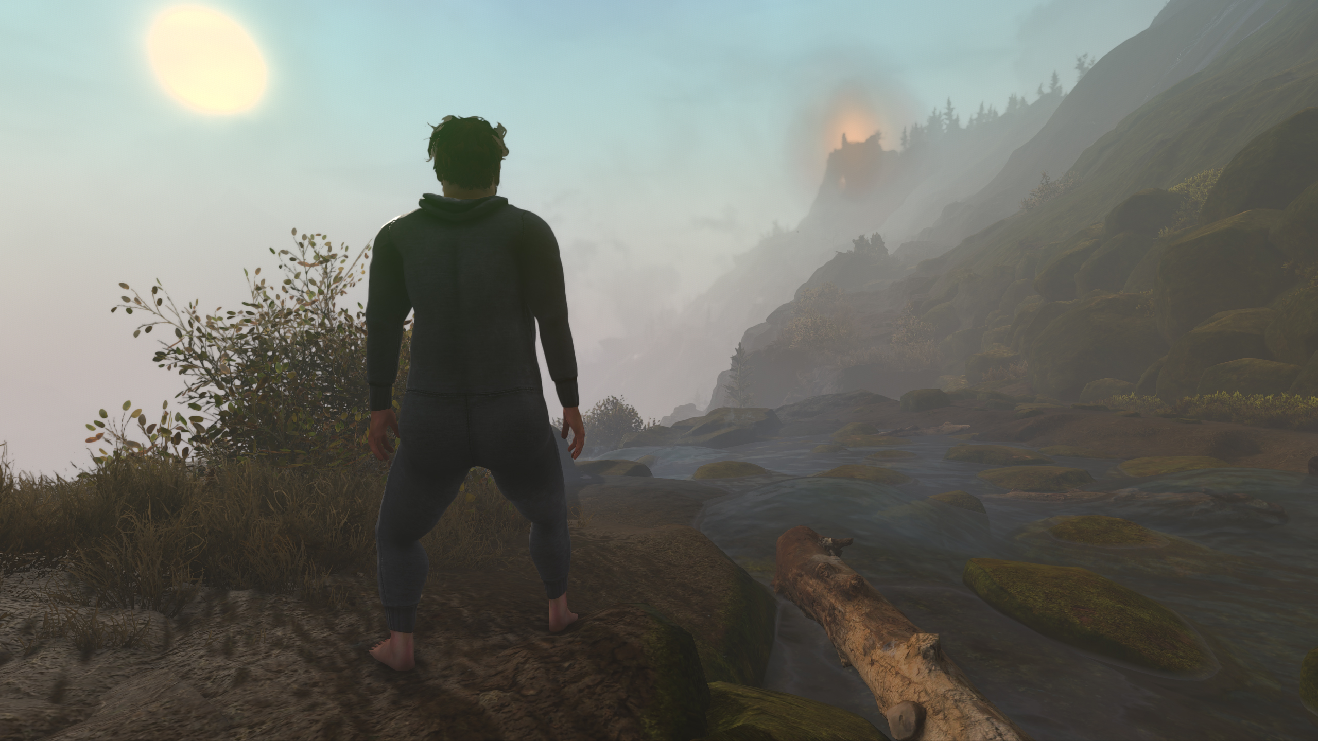 A man walking through the wilderness wearing a onesie