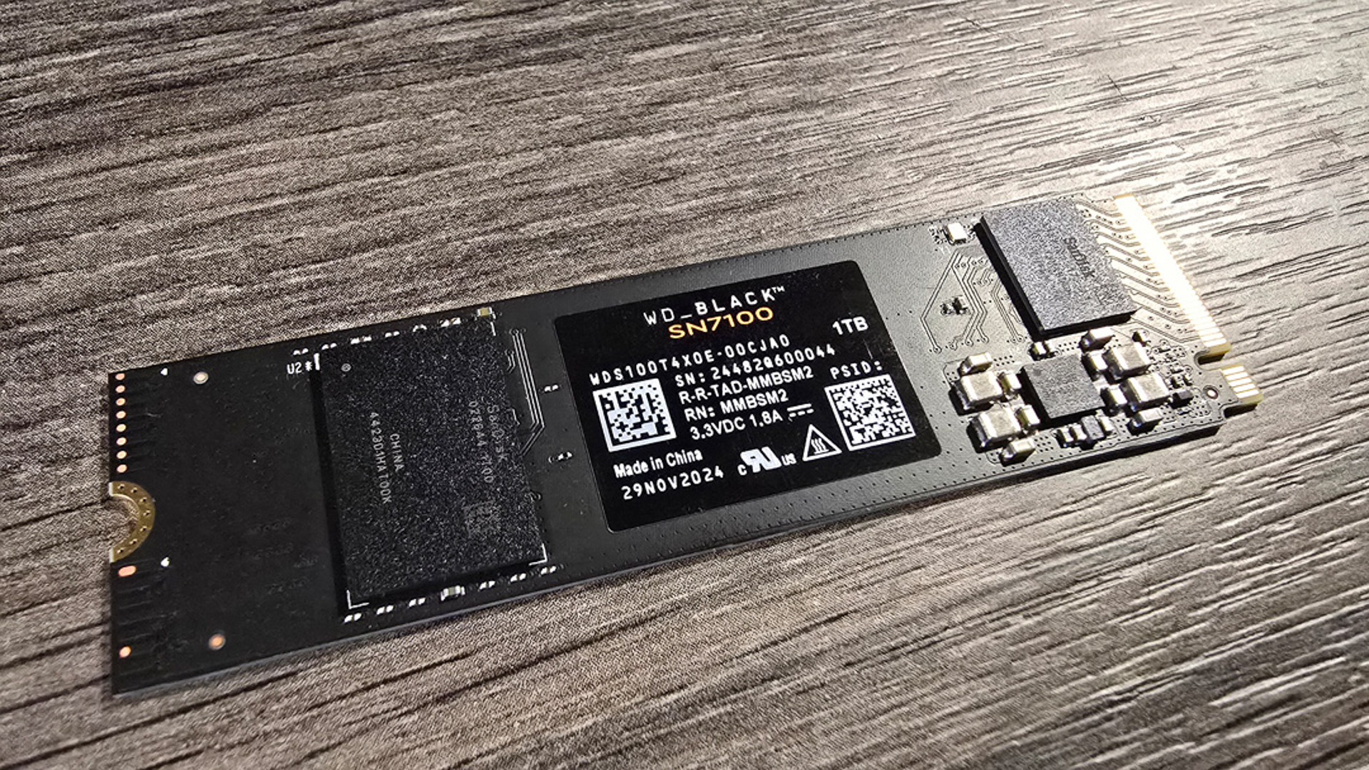 A WD Black SN7100 SSD installed inside a gaming PC.