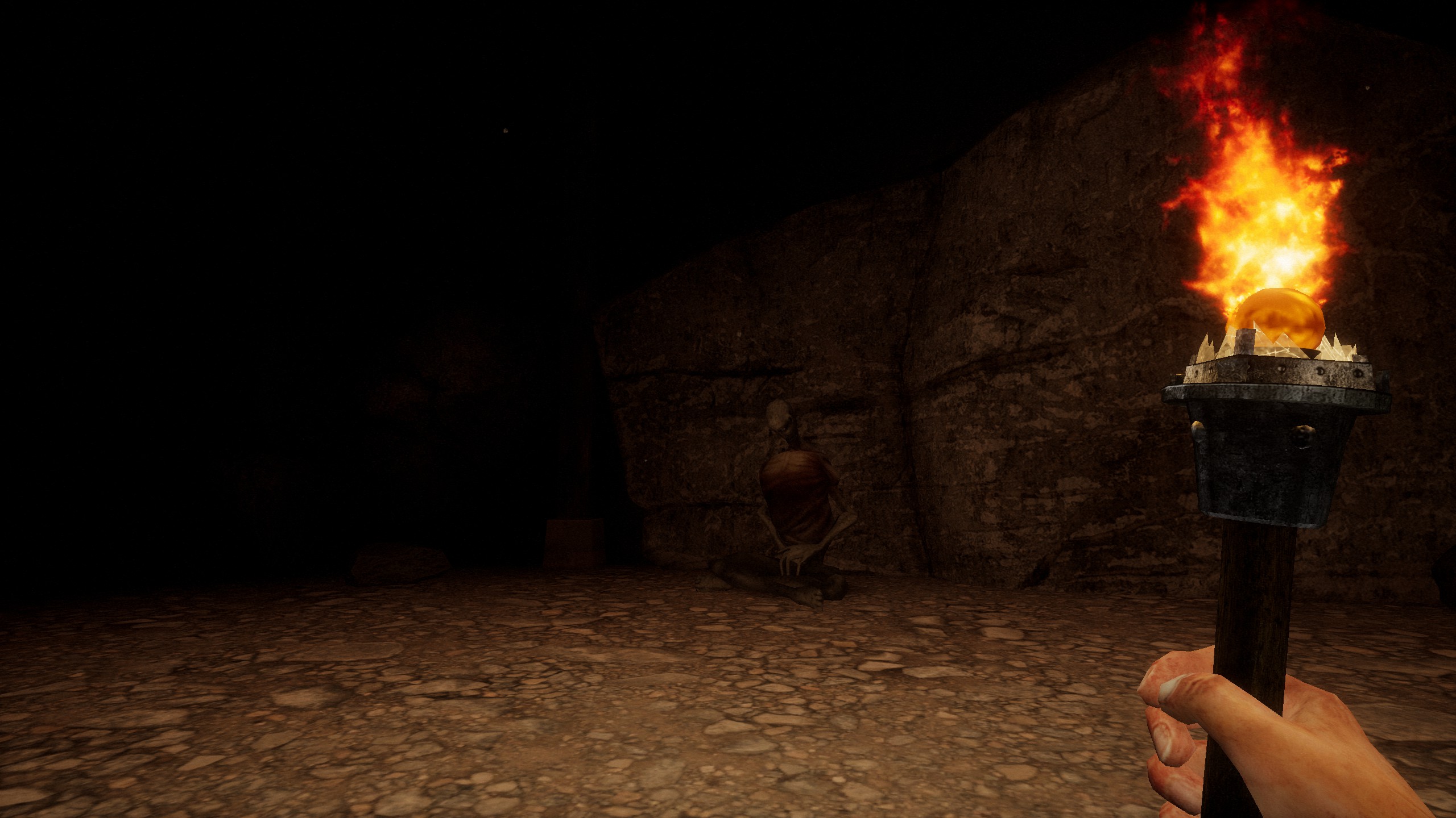 holding torch in dark cave looking at dead seated body