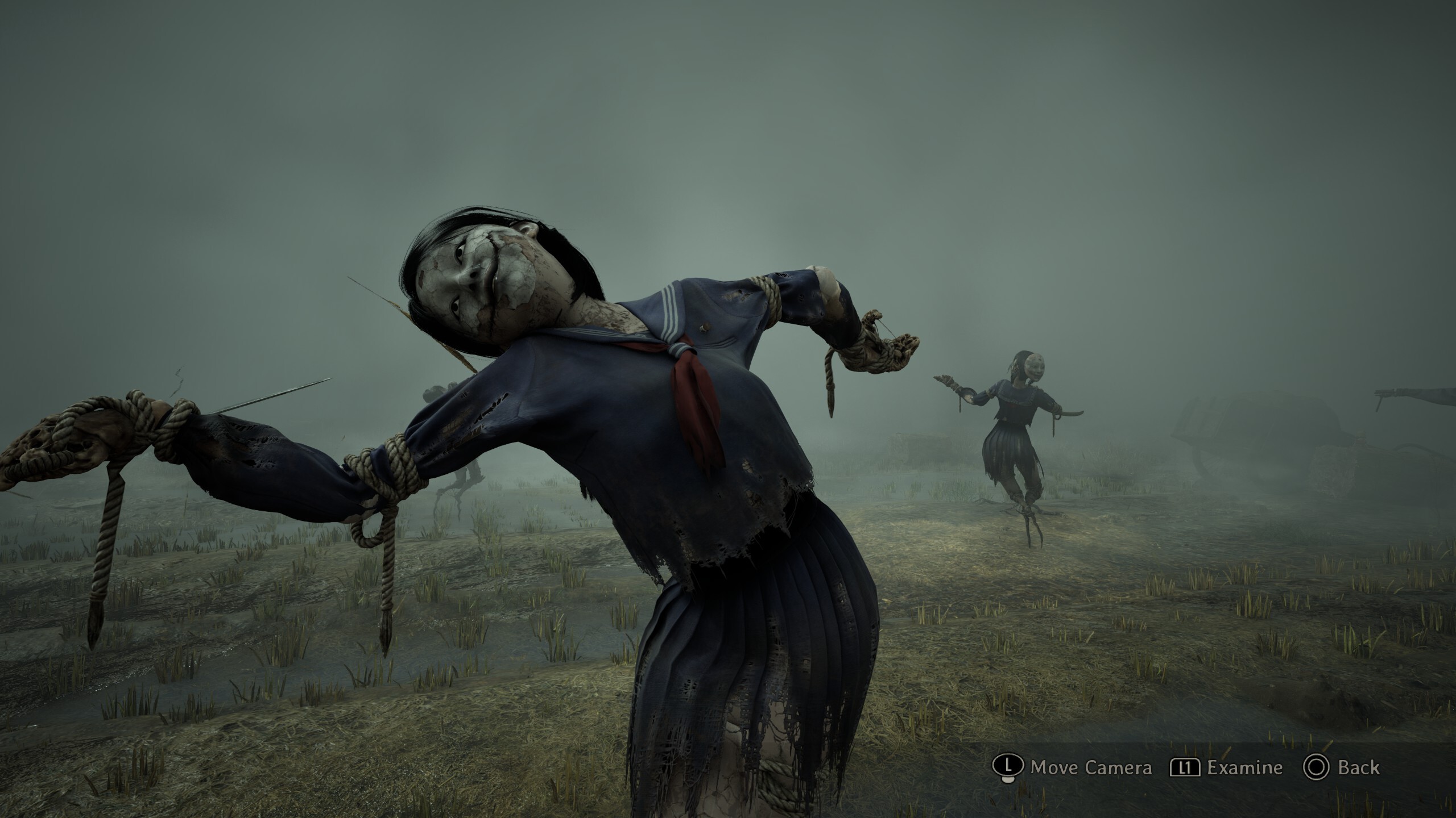 Silent Hill f scarecrow field puzzle: Scarecrows posing in a dark field.