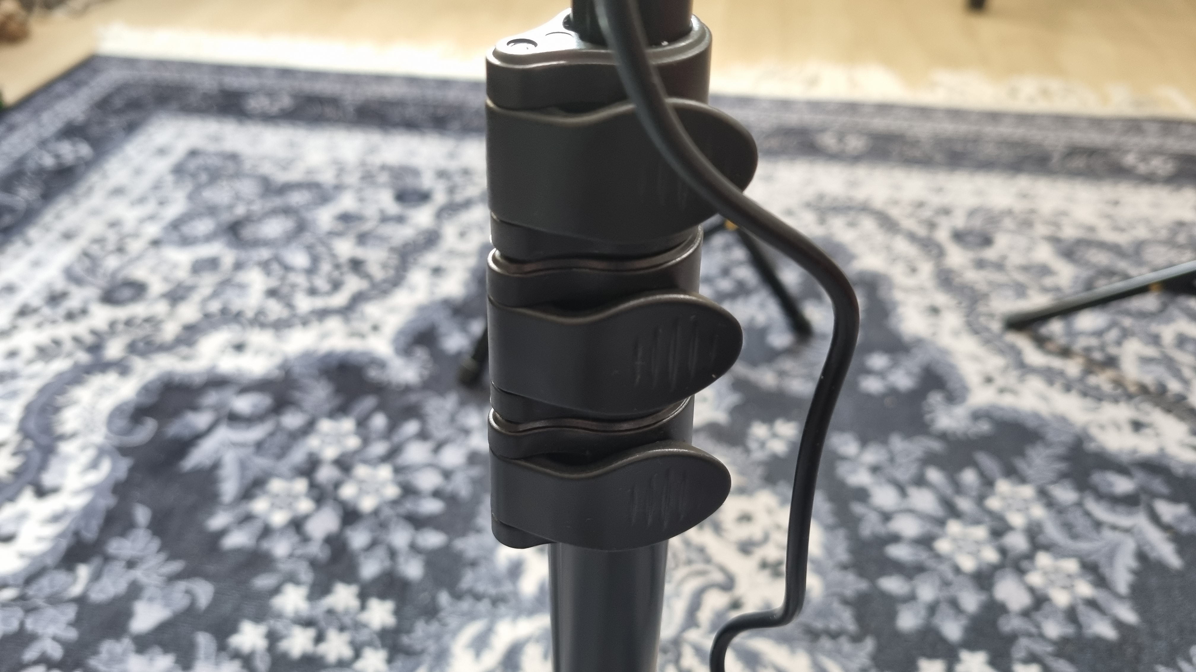 The adjustment clips on the pole of a light included with the Neewer Basics LED Video Light Kit