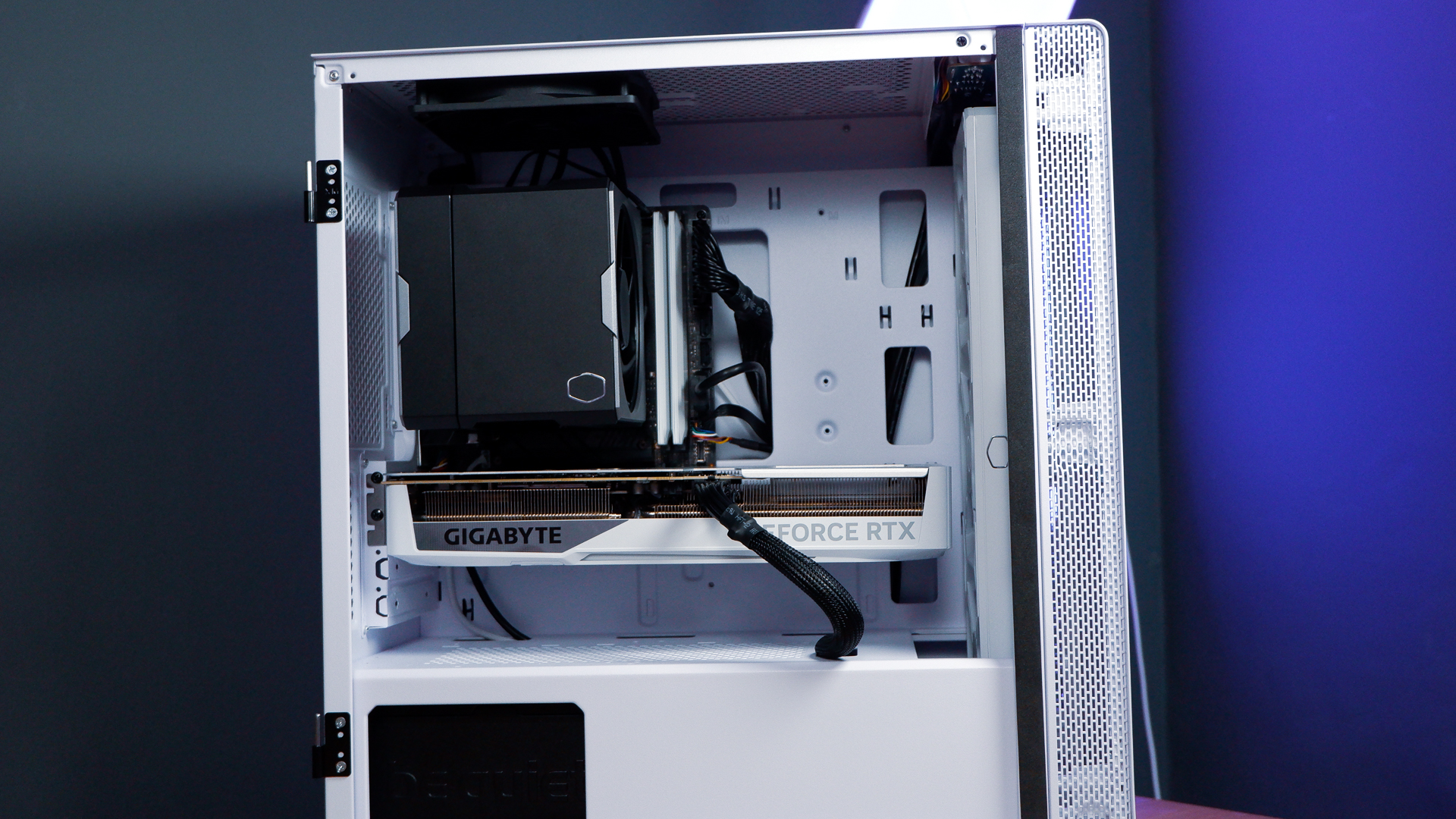 A white gaming PC built using a Thermaltake PC case, Cooler Master fans, and an AMD CPU.
