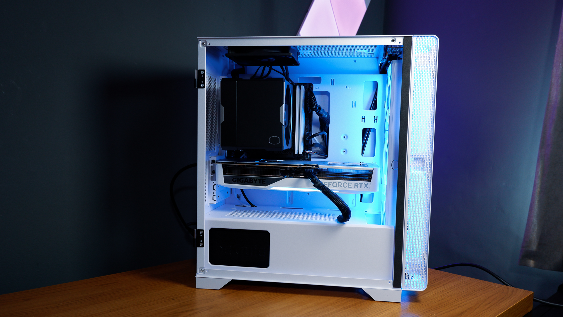 A white gaming PC built using a Thermaltake PC case, Cooler Master fans, and an AMD CPU.