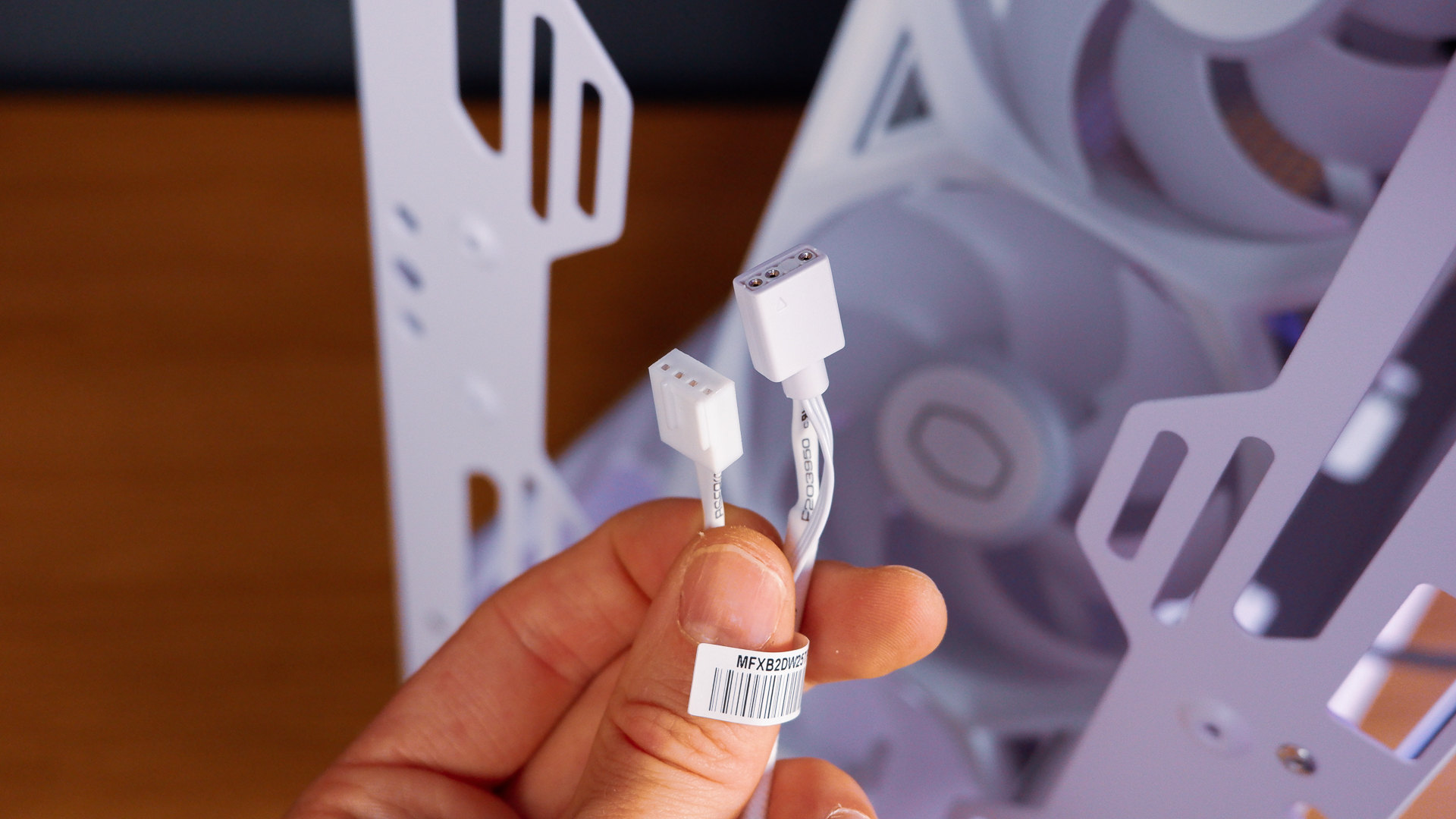 A white gaming PC built using a Thermaltake PC case, Cooler Master fans, and an AMD CPU.