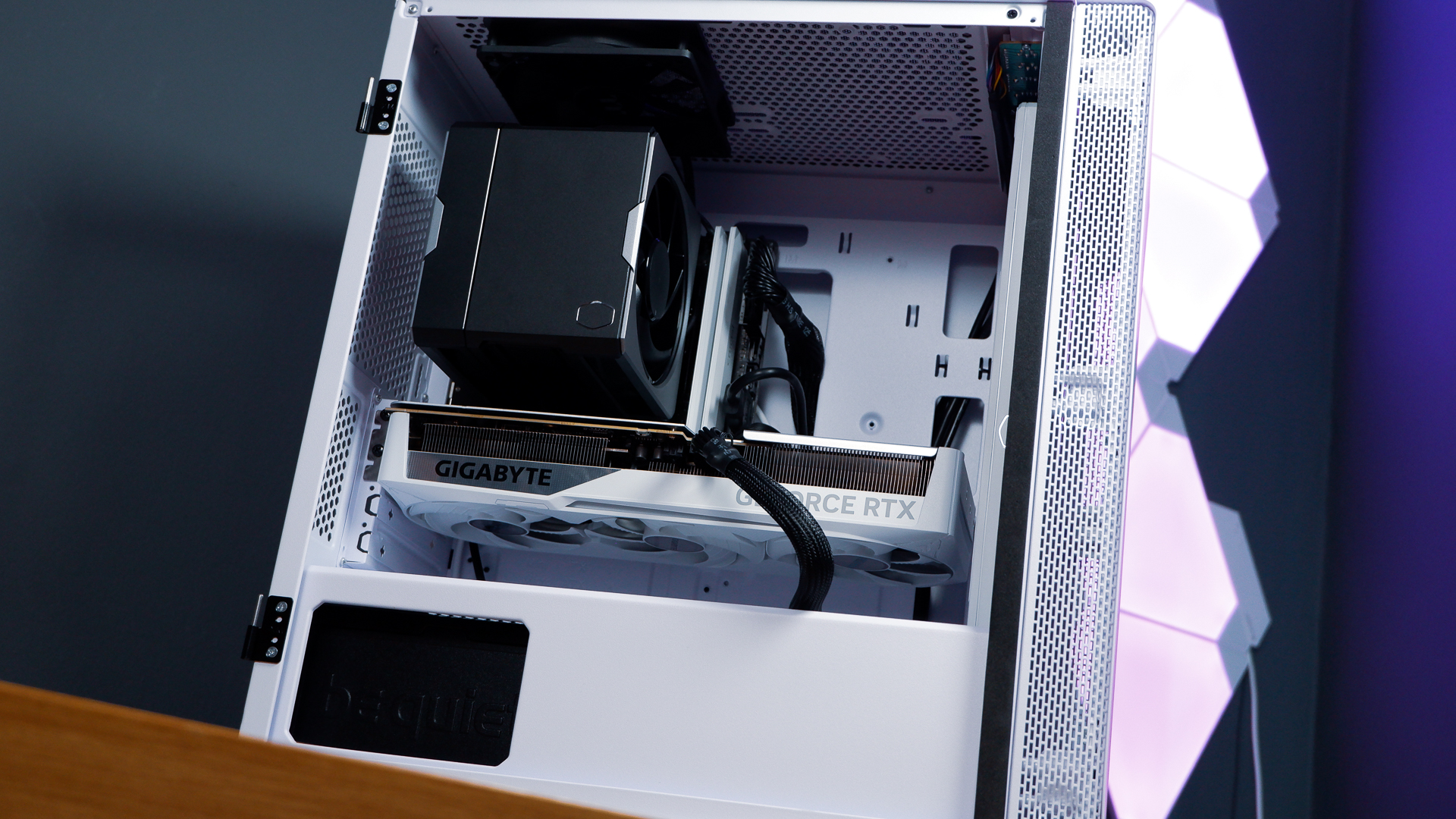 A white gaming PC built using a Thermaltake PC case, Cooler Master fans, and an AMD CPU.