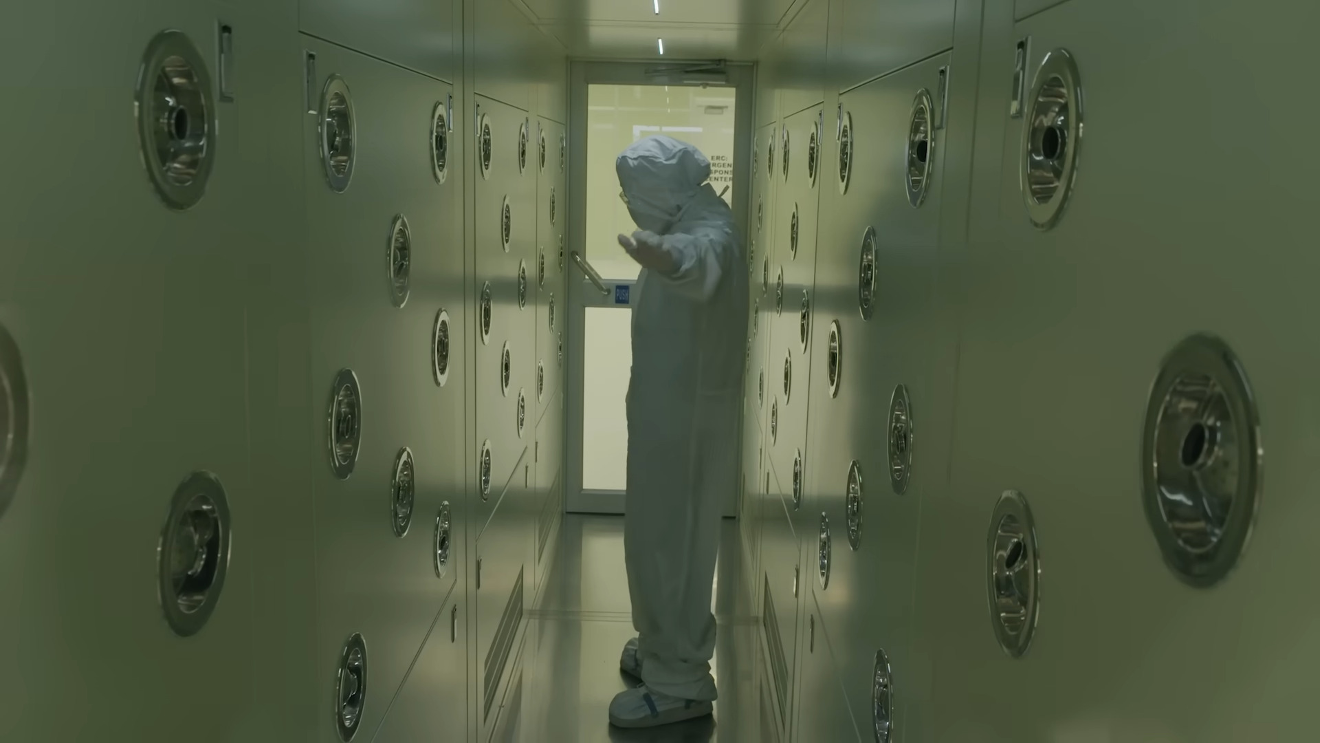 A worker wearing a bunny suit in TSMC's Arizona facility