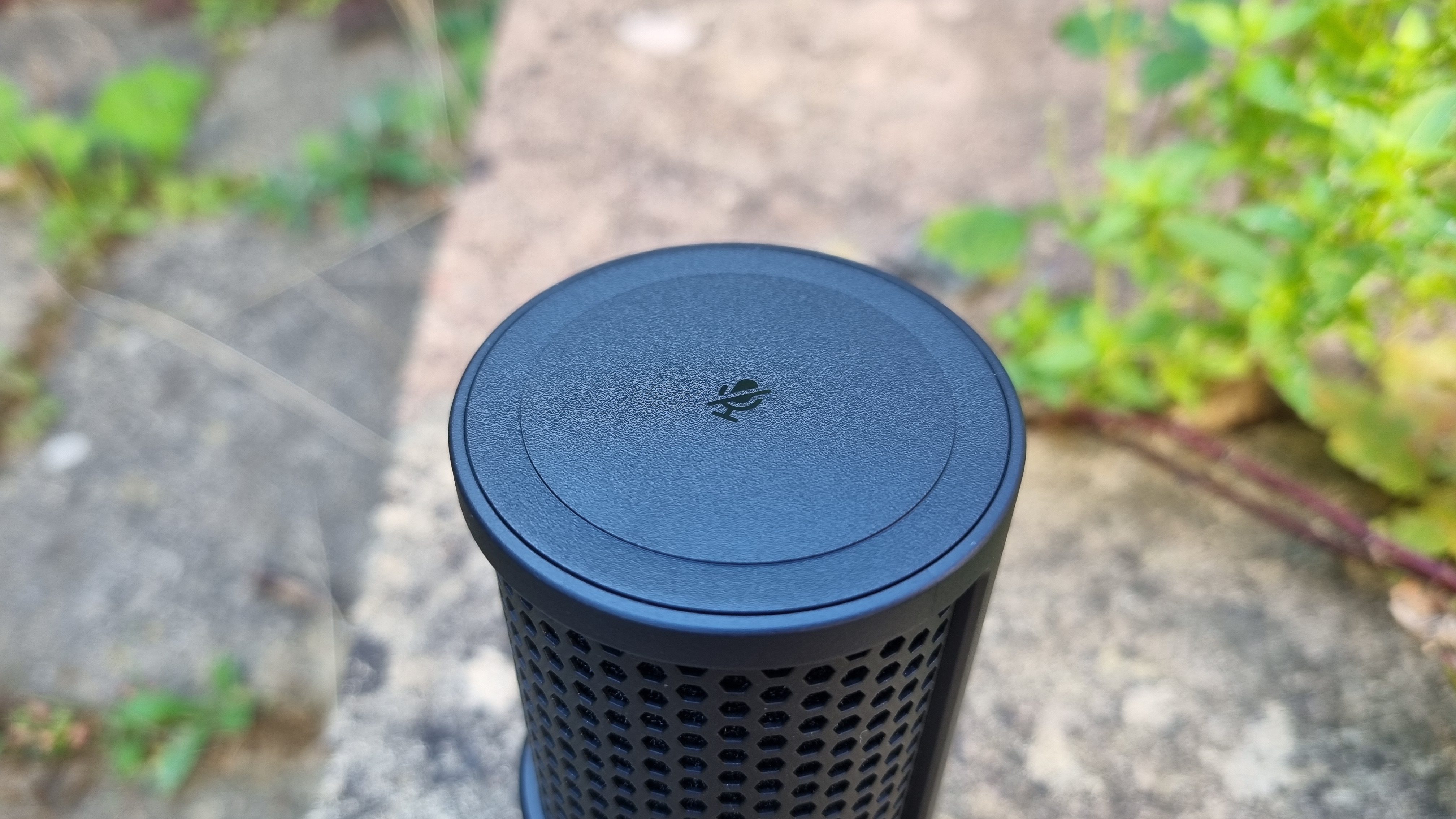 The top of the HyperX SoloCast 2 USB microphone, showing the large tap to mute button