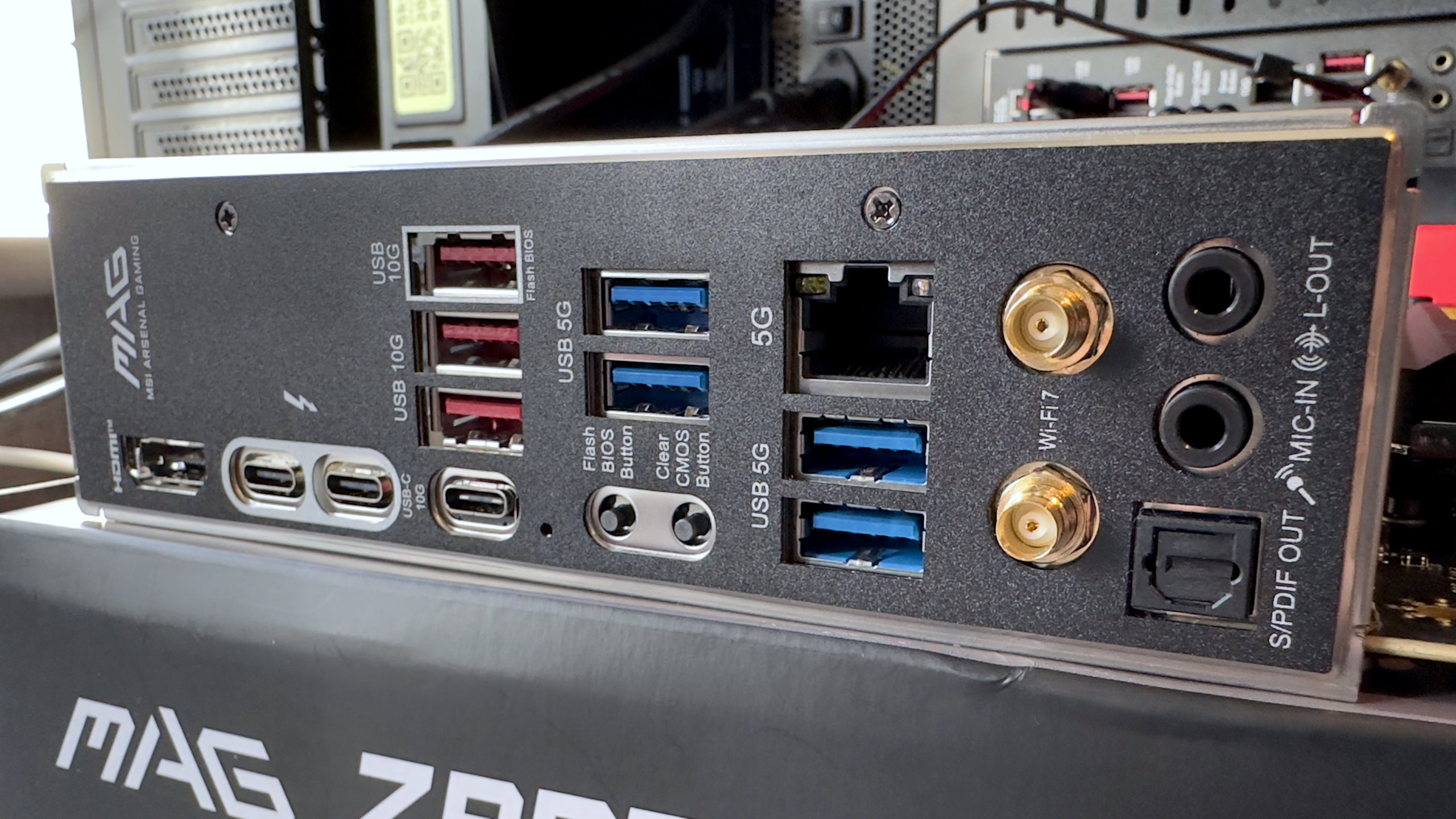 A photo of the MSI MAG Z890 Tomahawk WiFi motherboard, focused on its rear IO panel.