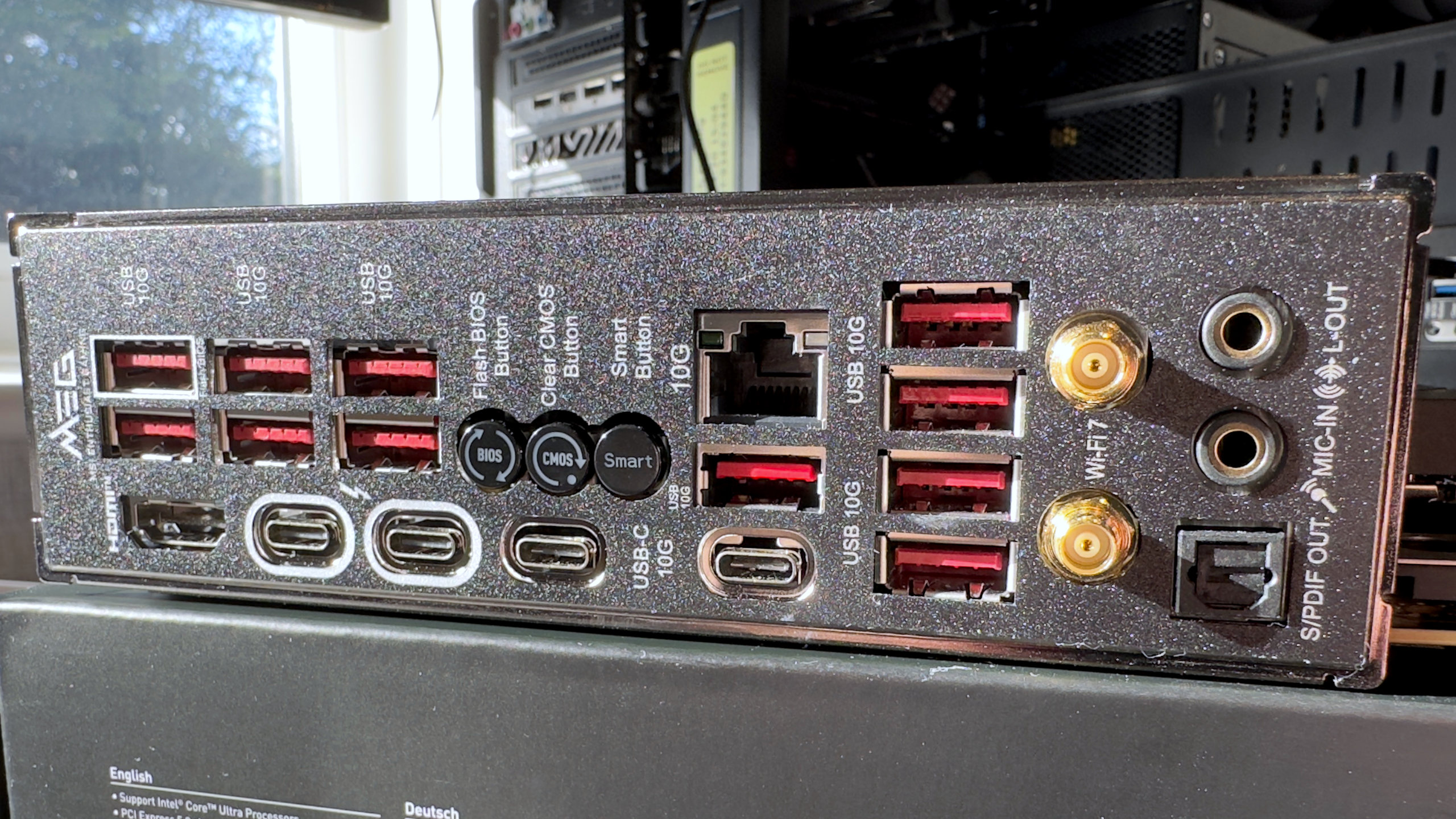 A photo of the MSI MEG Z890 Ace motherboard, showing its rear IO panel.
