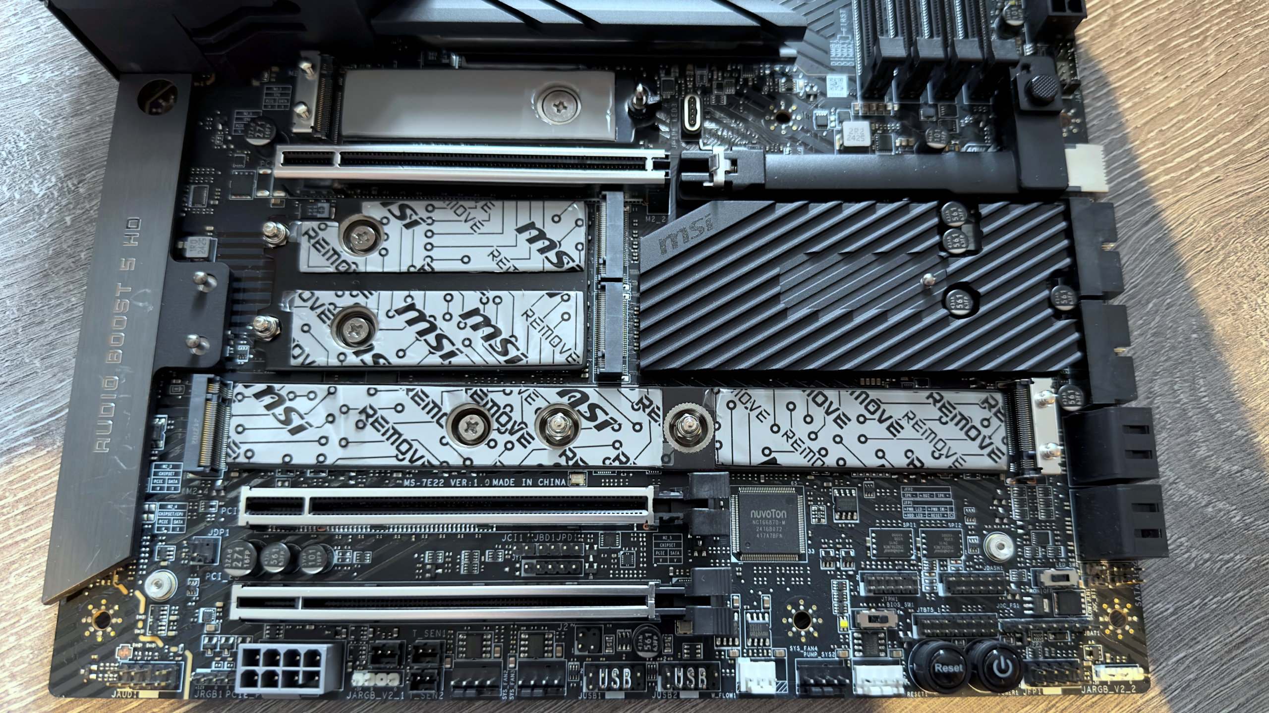A photo of the MSI MEG Z890 Ace motherboard, focused on the M.2 slots with the heatsinks removed.